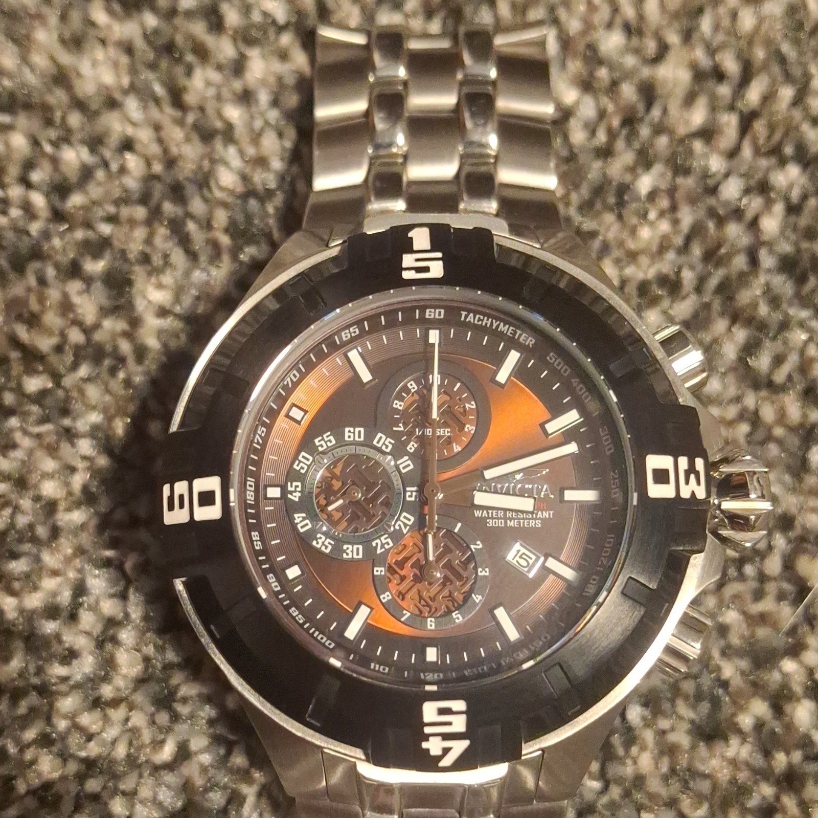 Invicta Men’s Quartz Chronograph 300m SS Black/Orange Dial Silver Bracelet
