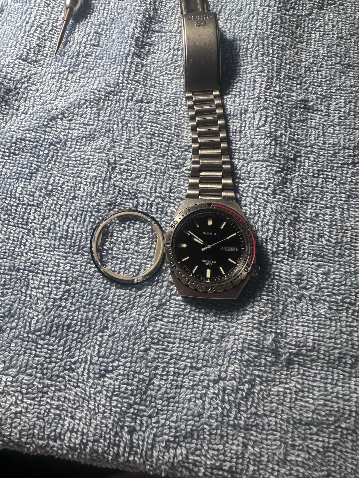 Seiko Sports 100 Men’s Quartz Day/Date Black Dial Rotating Bezel Steel