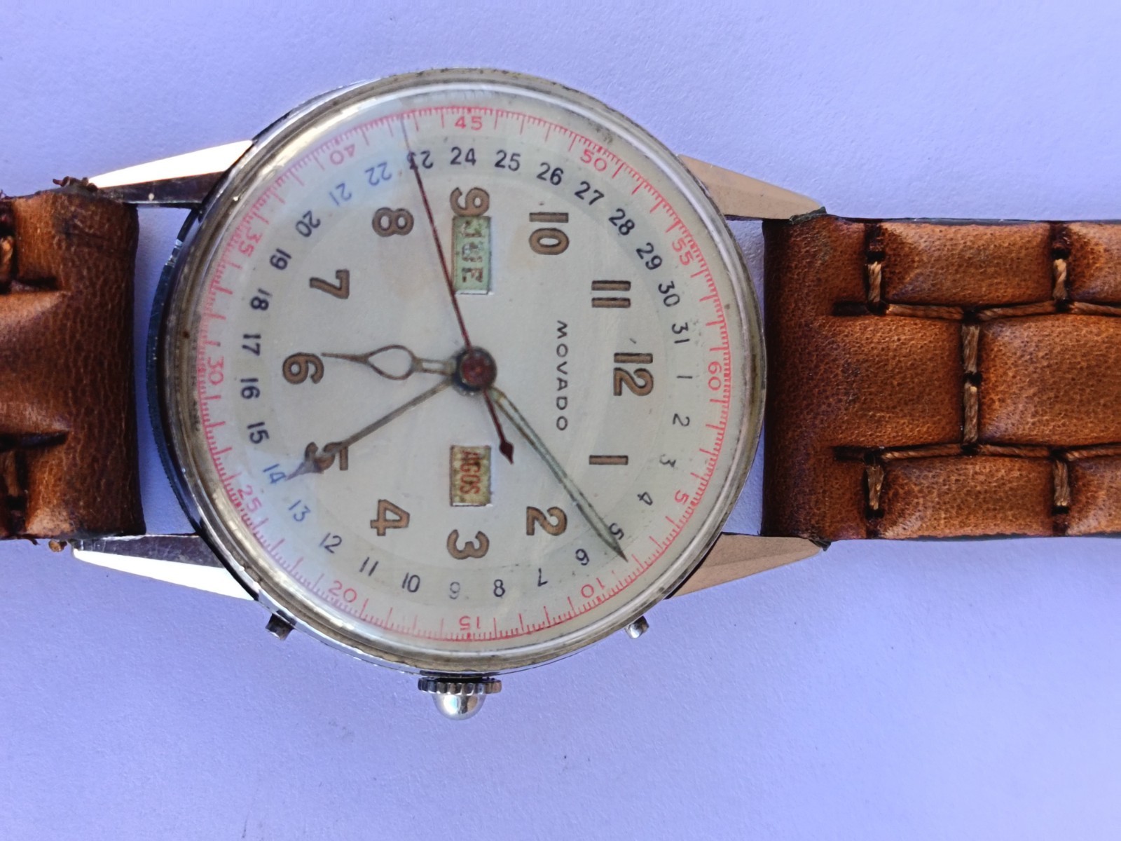 VINTAGE MOVADO TRIPLE DATE. MANUAL WIND. MULTICOLOUR DIAL. RUNNING
