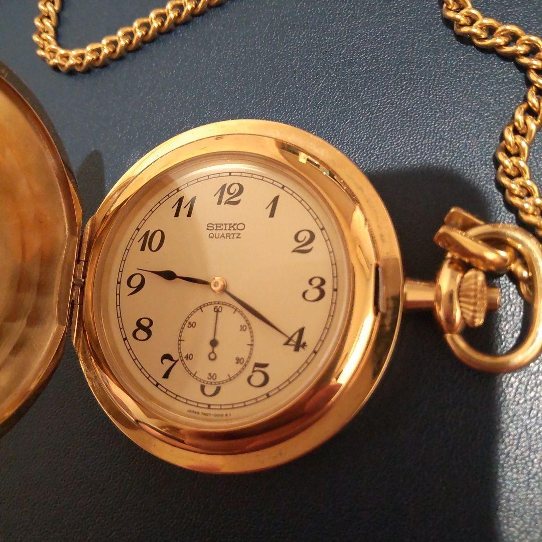 SEIKO pocket watch, gold color, with chain.