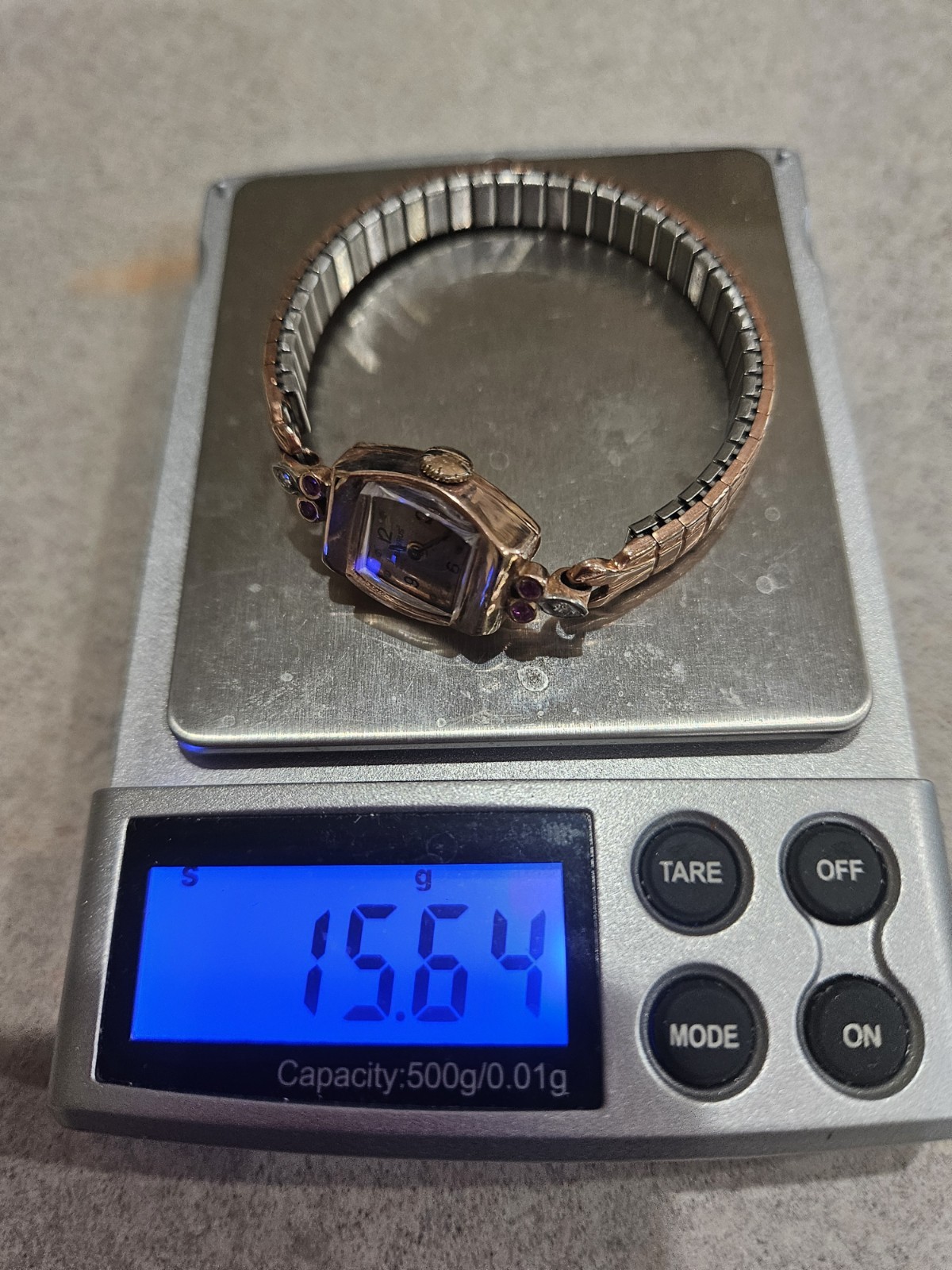 VINTAGE 14 KT BENRUS ROSEGOLD LADIES WATCH WITH RUBIES AND DIAMONDS.
