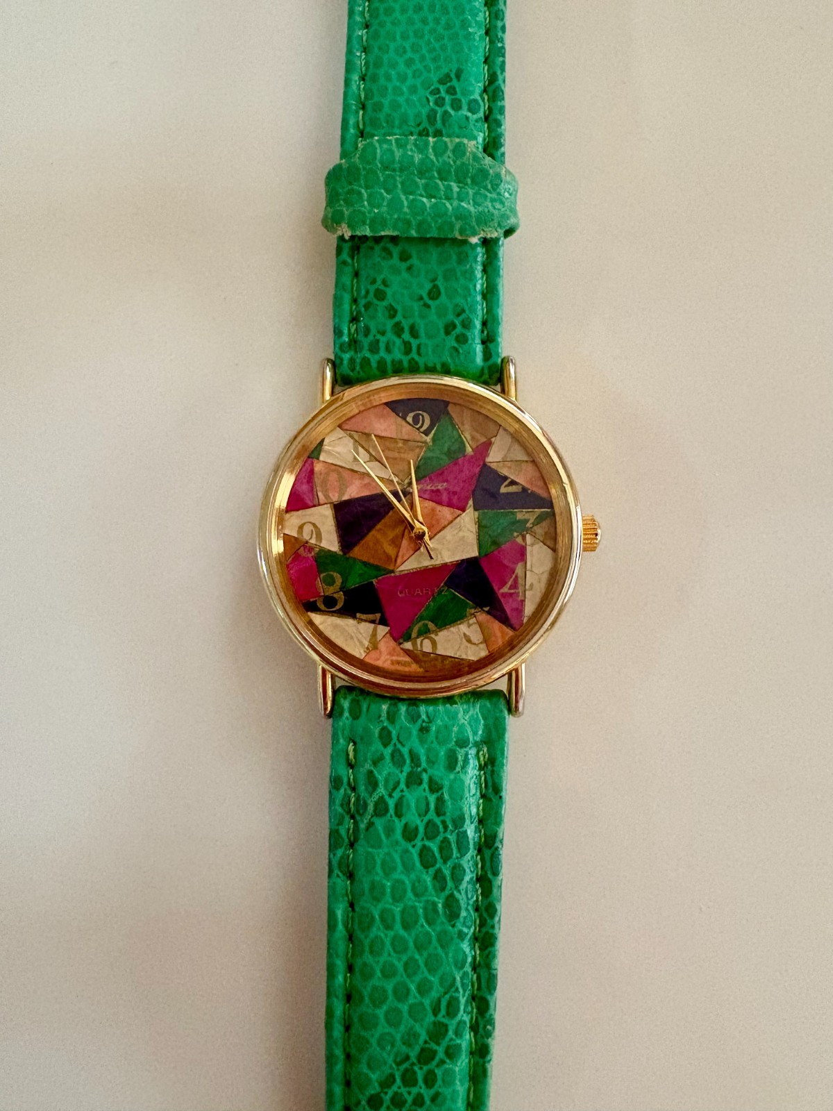 Green Quartz Ronica Watch with geometric design on face, used watchband