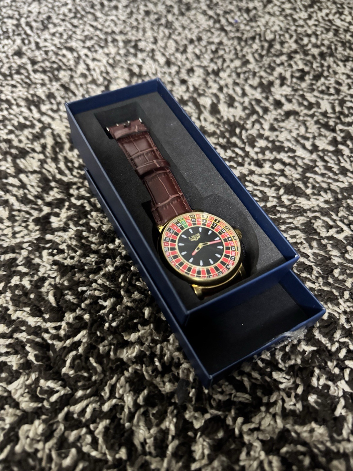 Analog Wristwatch Black Dial Multicolor/Gold Bezel Gold Case Brown Leather Box