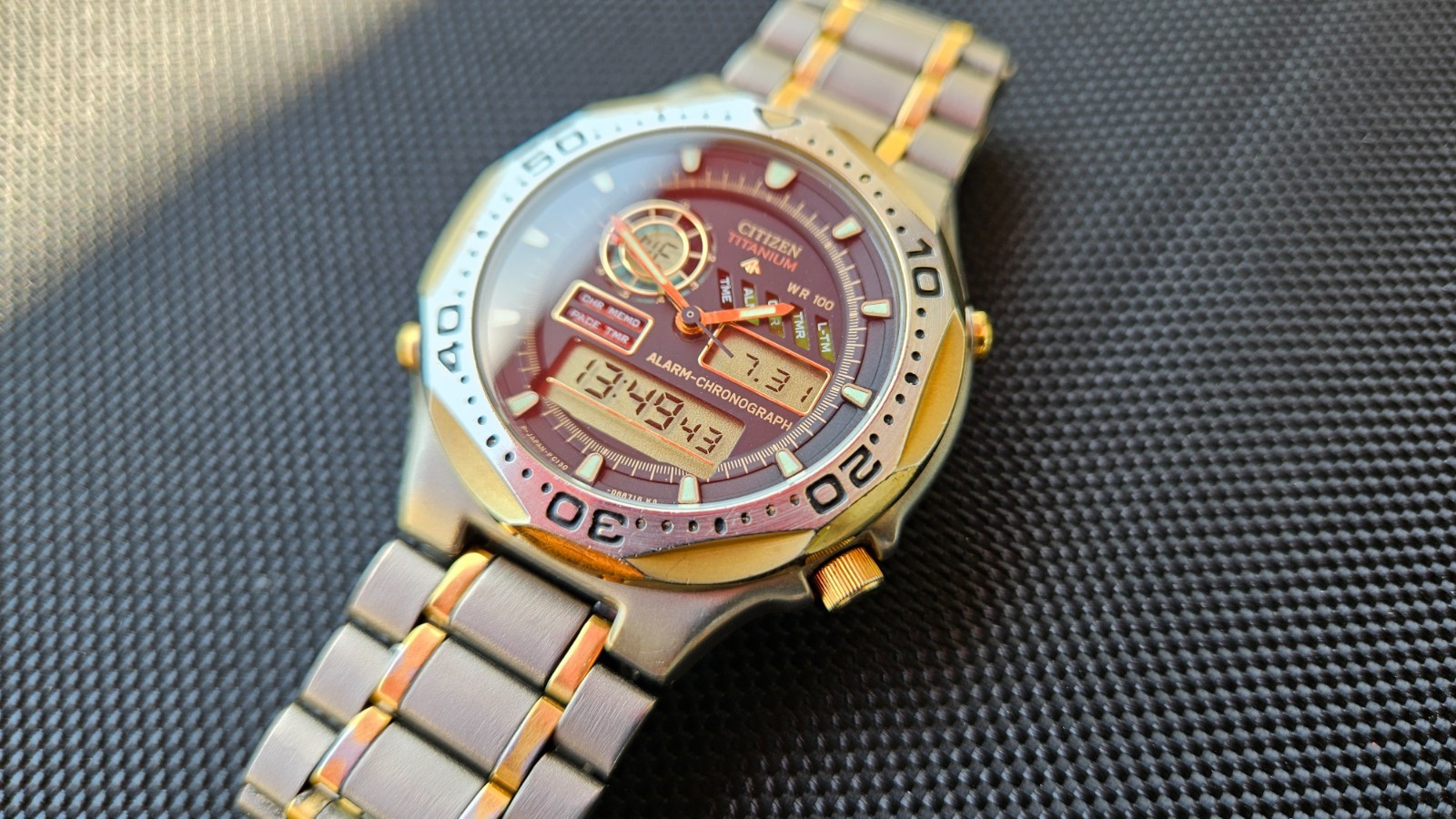 Citizen Promaster Pace Timer Titanium WR100 C130-089685 two-tone gold accents
