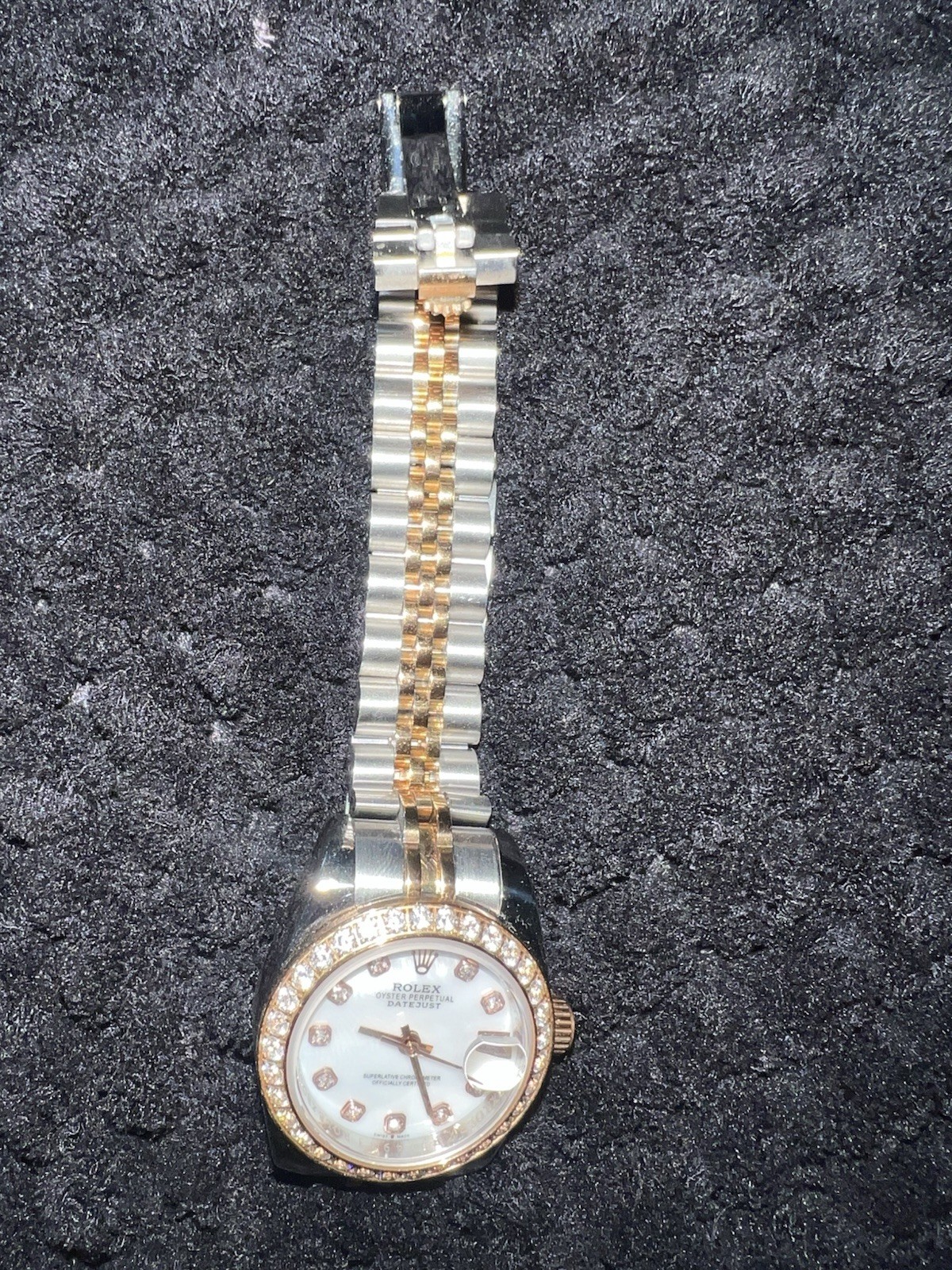 This watch is a 28 mm Rolex Lady-Datejust, model 279381RBR with diamonds