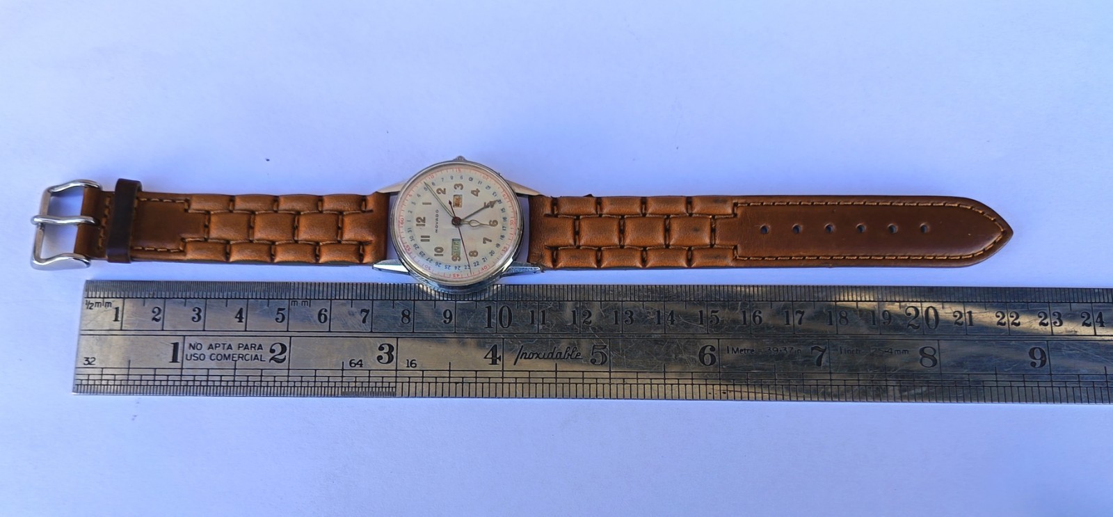 VINTAGE MOVADO TRIPLE DATE. MANUAL WIND. MULTICOLOUR DIAL. RUNNING