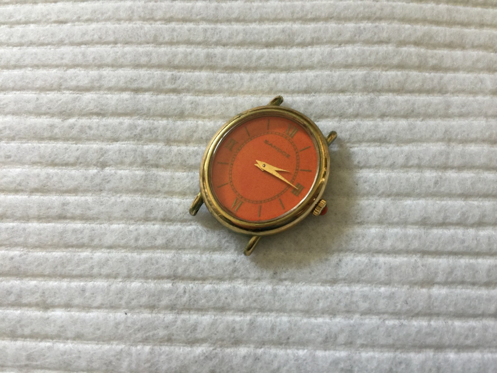 Sandoz Mechanical Wind Up Ladies Watch with an Orange Dial