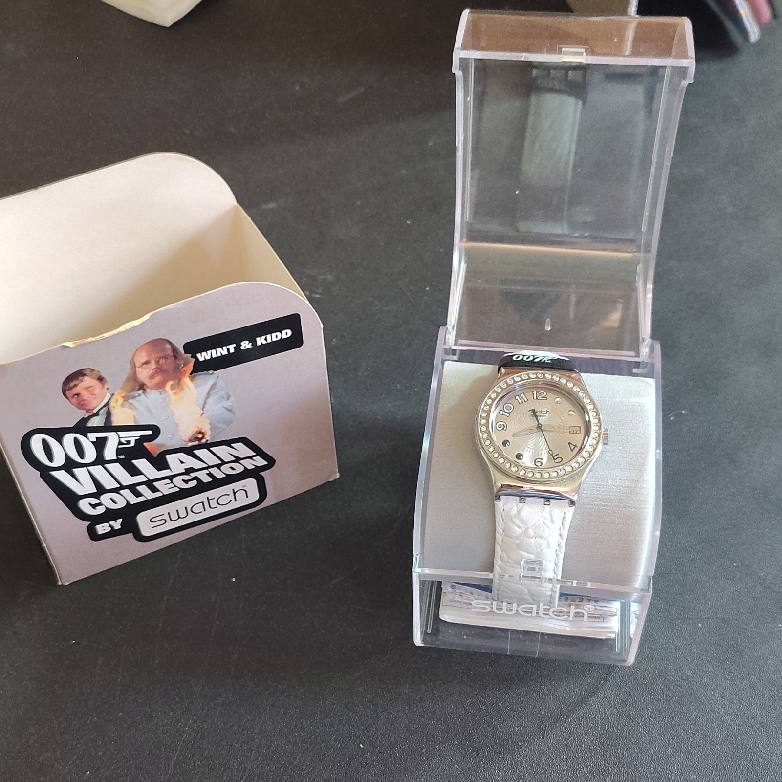 Swatch YLS434 James Bond Villain Quartz Analog Silver Dial White Leather