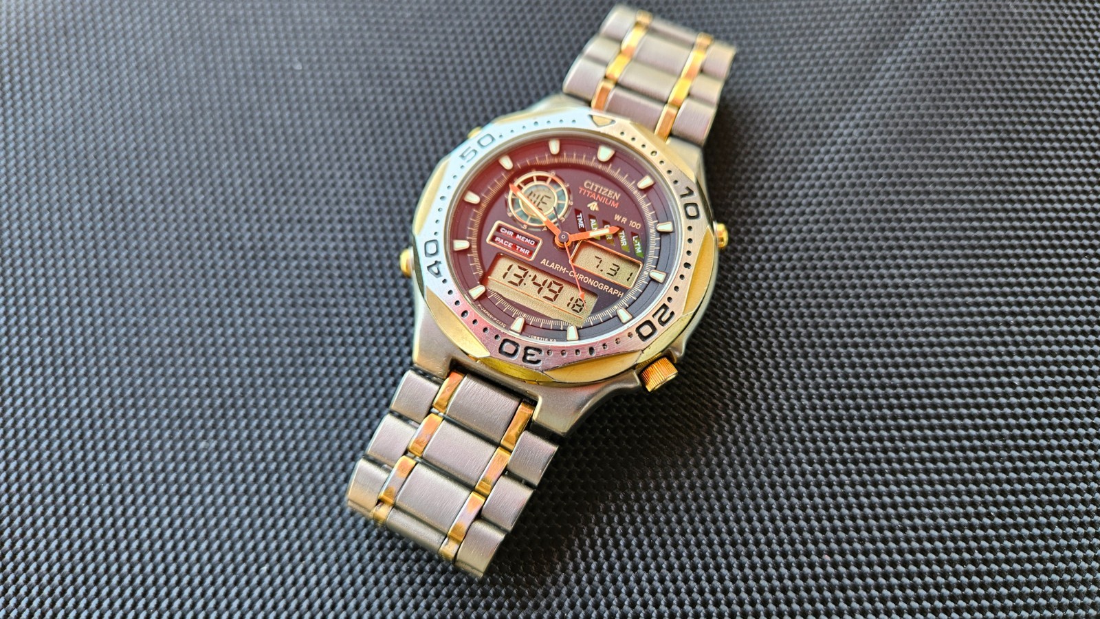 Citizen Promaster Pace Timer Titanium WR100 C130-089685 two-tone gold accents