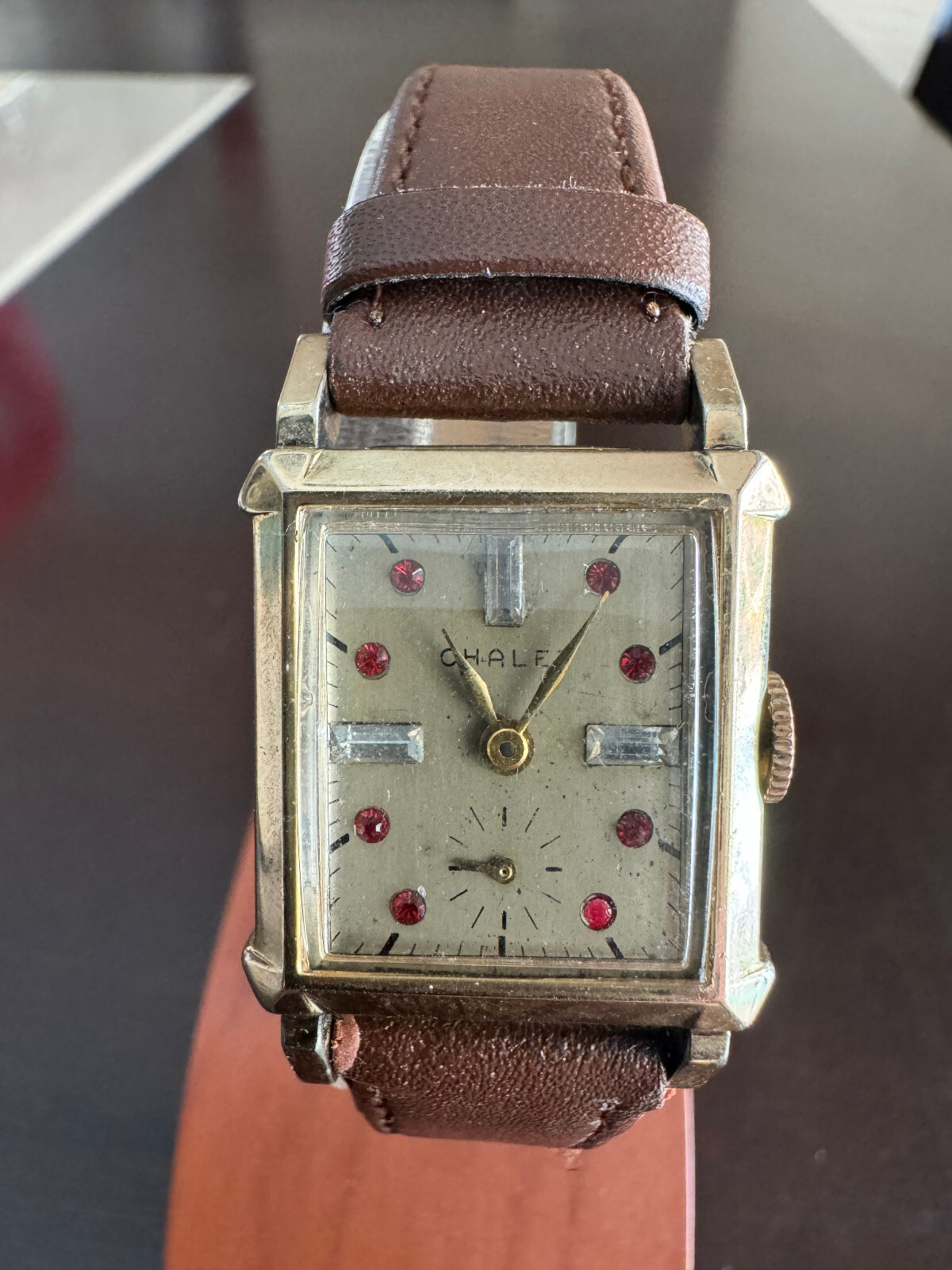 VINTAGE UNISEX CHALET FAUX DIAMOND AND RUBY DIAL WRIST WATCH, KEEPING TIME