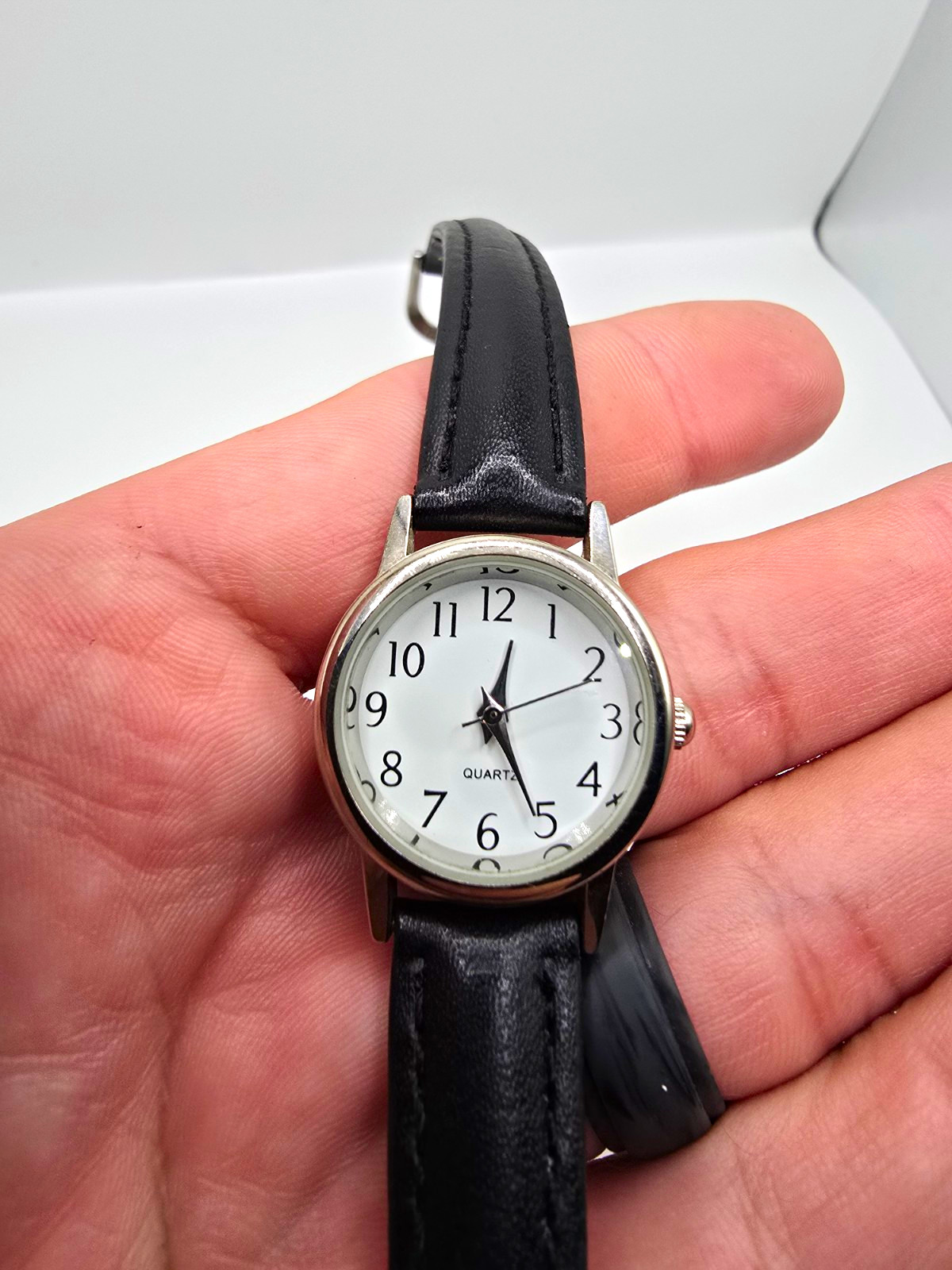 Accutime Quartz Analog Wristwatch White Dial Arabic Numerals Silver Case 26mm