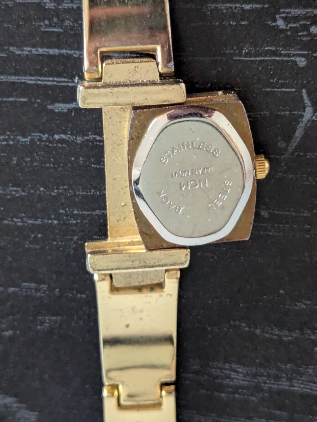 Gold plated watch by Royaltin with red crystal or Ruby not sure which. Very min