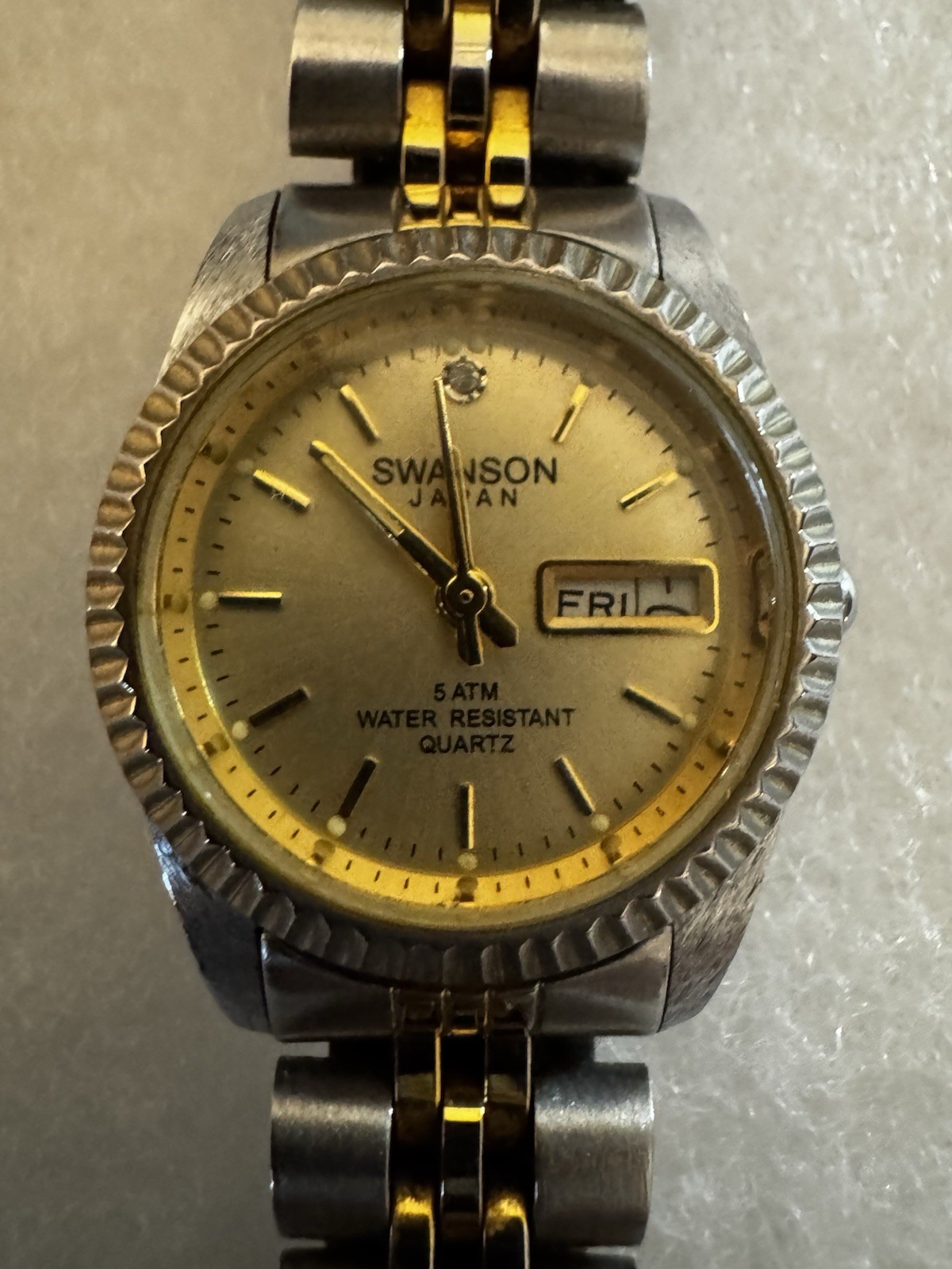 Swanson Quartz Analog Wristwatch Day/Date 50m 5 ATM Two-Tone Bracelet Women’s