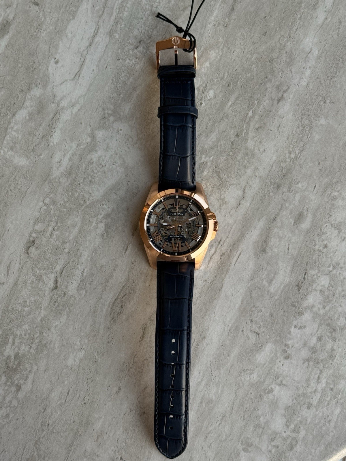 Bulova Sutton Men’s 43mm Automatic Skeleton Dial Rose Gold/Blue Leather w/ Box