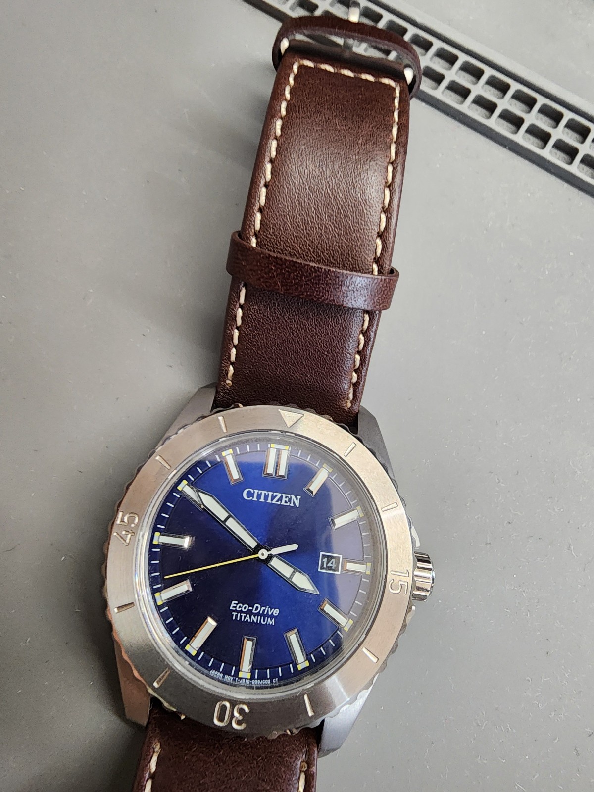 Citizen AW1840-09L Brycen Titanium Case Eco-Drive Leather Strap Blue Dial Watch