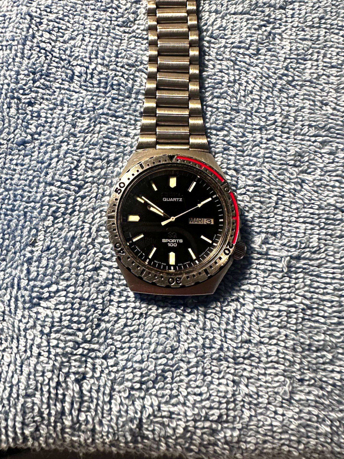 Seiko Sports 100 Men’s Quartz Day/Date Black Dial Rotating Bezel Steel