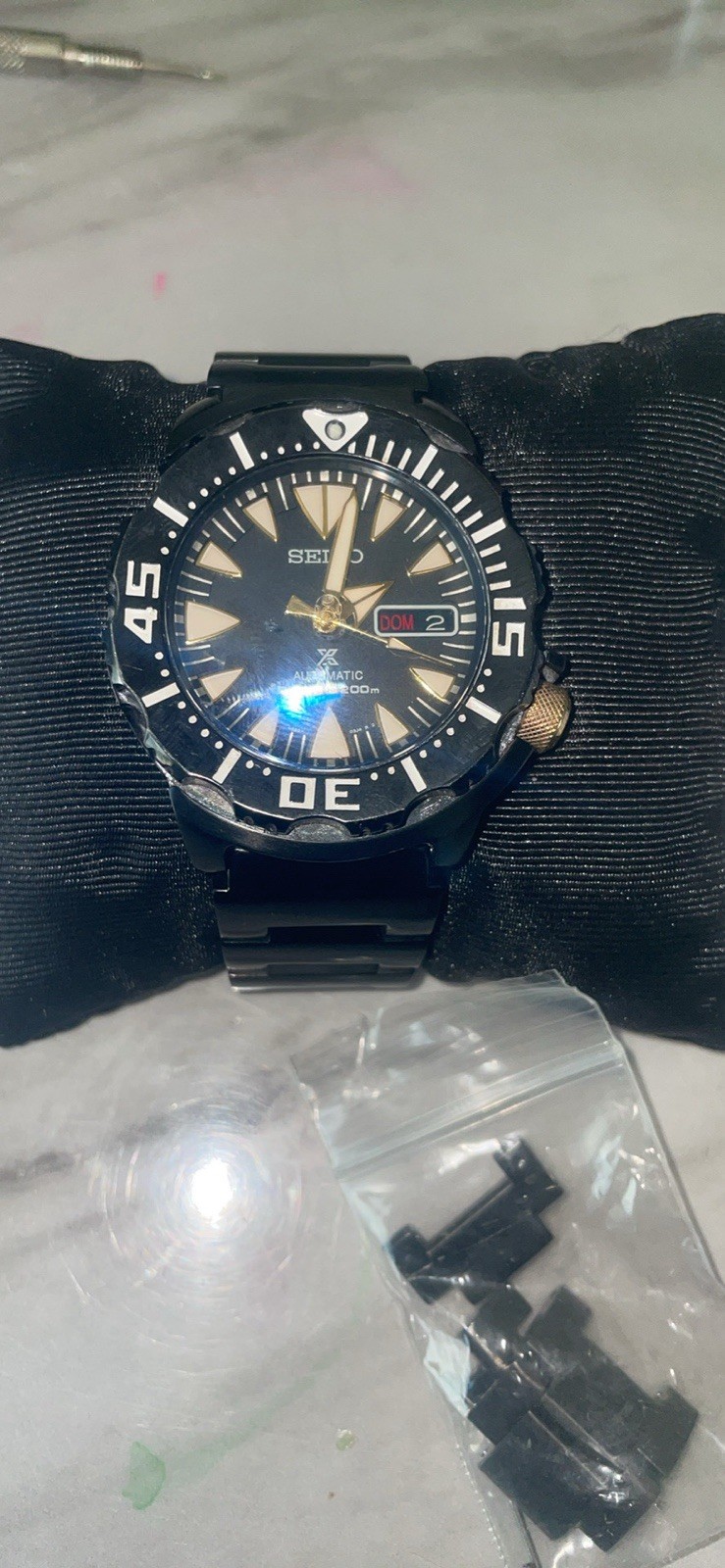 Seiko SRP583 Black Ion Monster black PVD-coated, gold-tone crown extra crysta