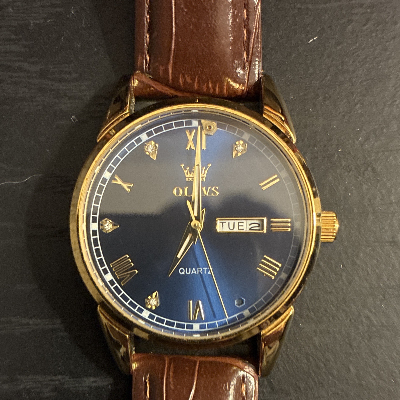 OLEVS Men’s Quartz Day/Date Blue Roman Dial Gold SS Watch Brown Leather Strap
