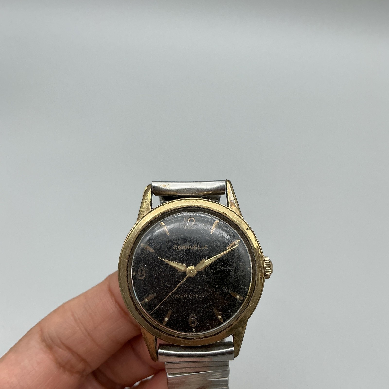 Vintage Caravelle Mens Watch 33mm Black Dial Gold Tone Stretch Band Manual Wind
