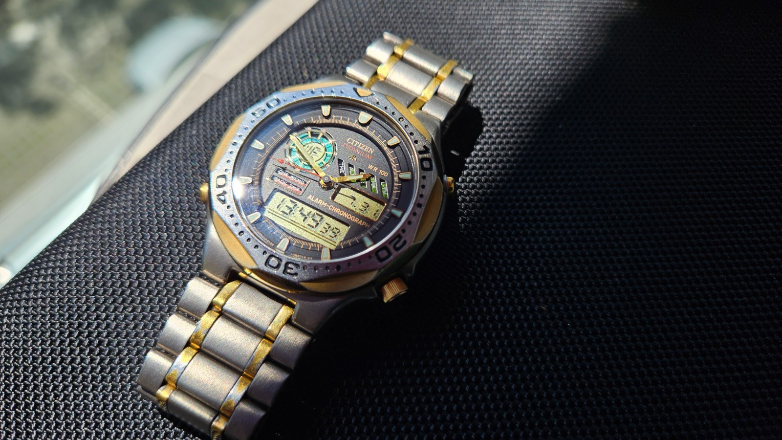 Citizen Promaster Pace Timer Titanium WR100 C130-089685 two-tone gold accents