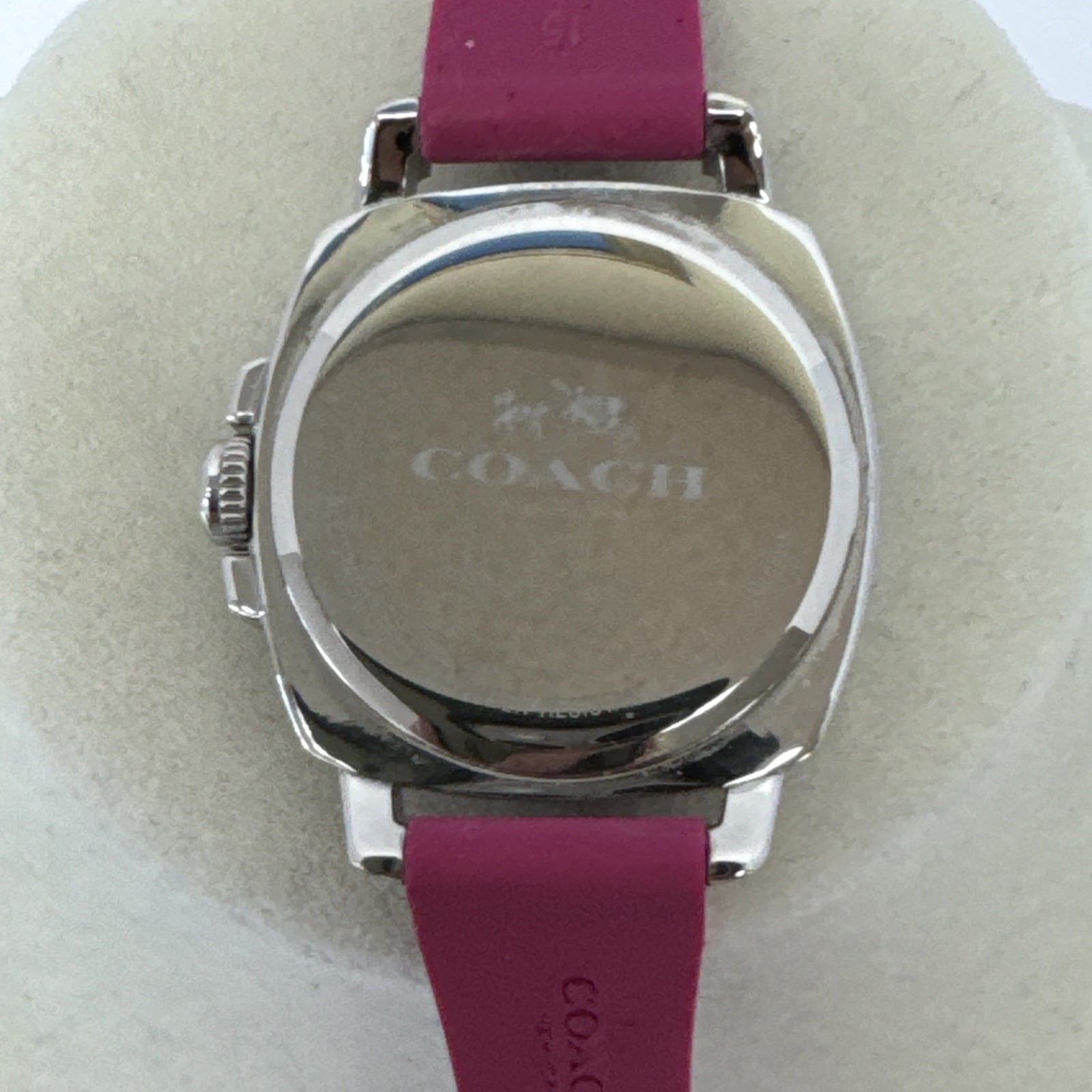 Coach Boyfriend watch featuring a vibrant pink logo-embossed silicone strap.
