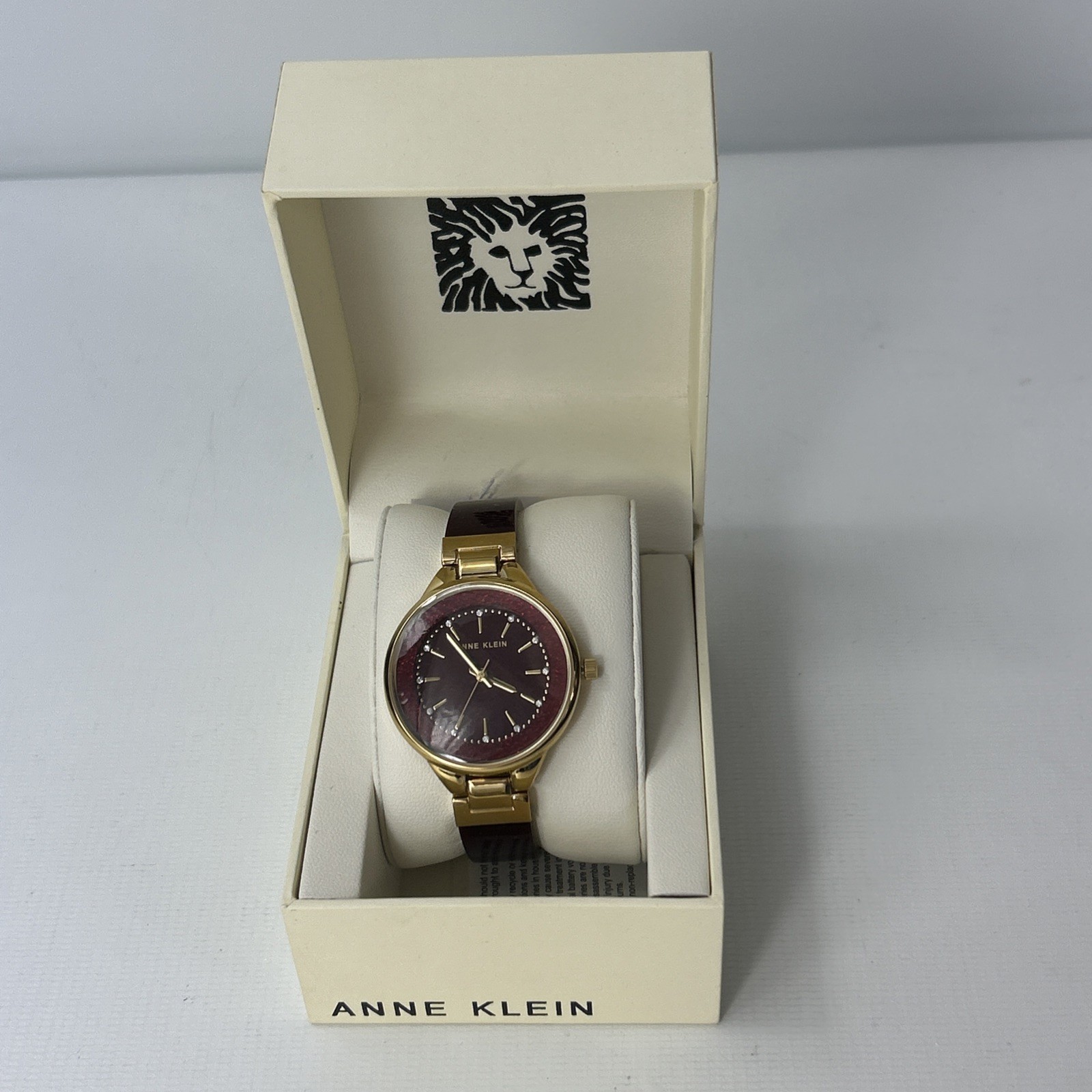 Anne Klein Women’s Quartz Burgundy Resin Gold-Tone Watch – AK/1408BYBY