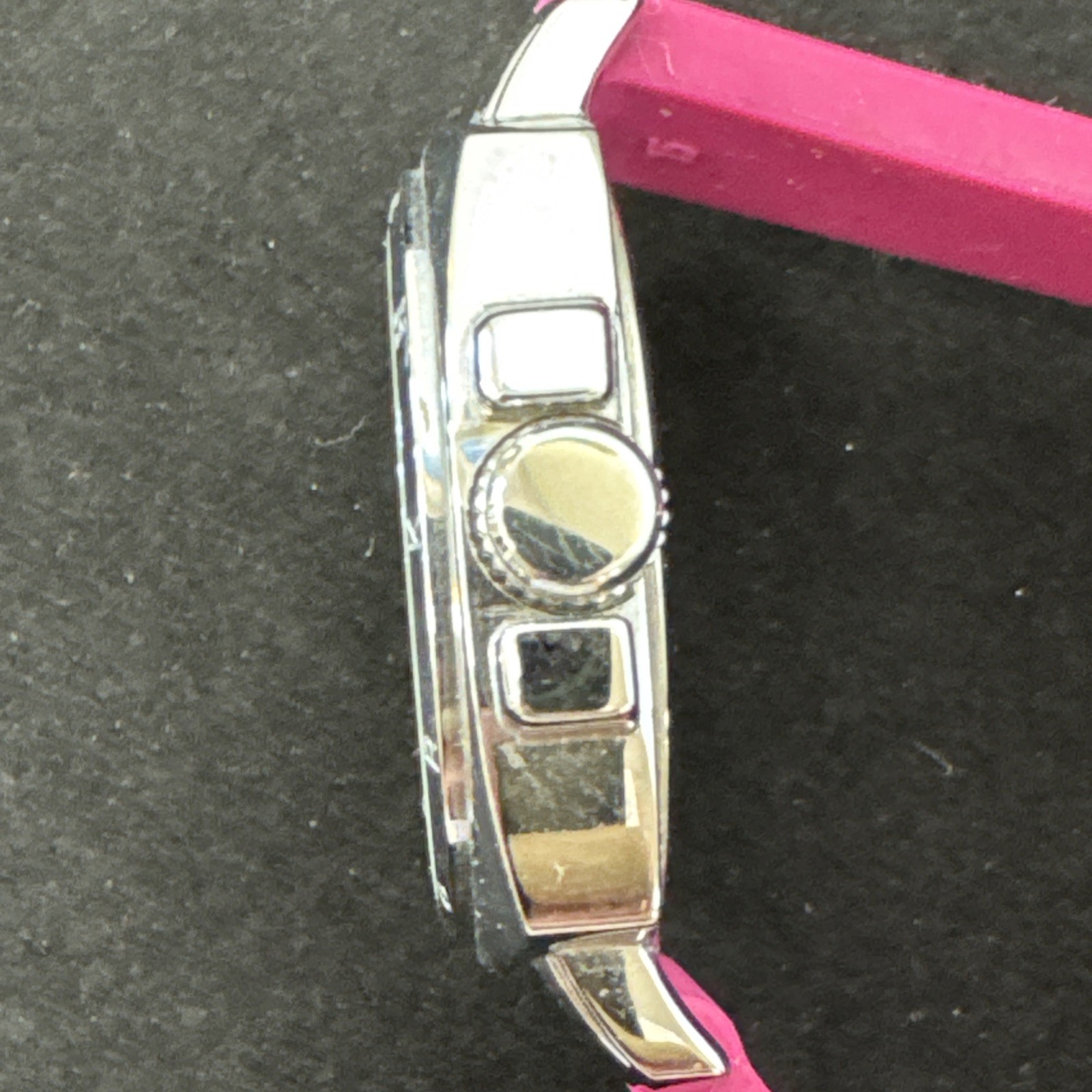 Coach Boyfriend watch featuring a vibrant pink logo-embossed silicone strap.