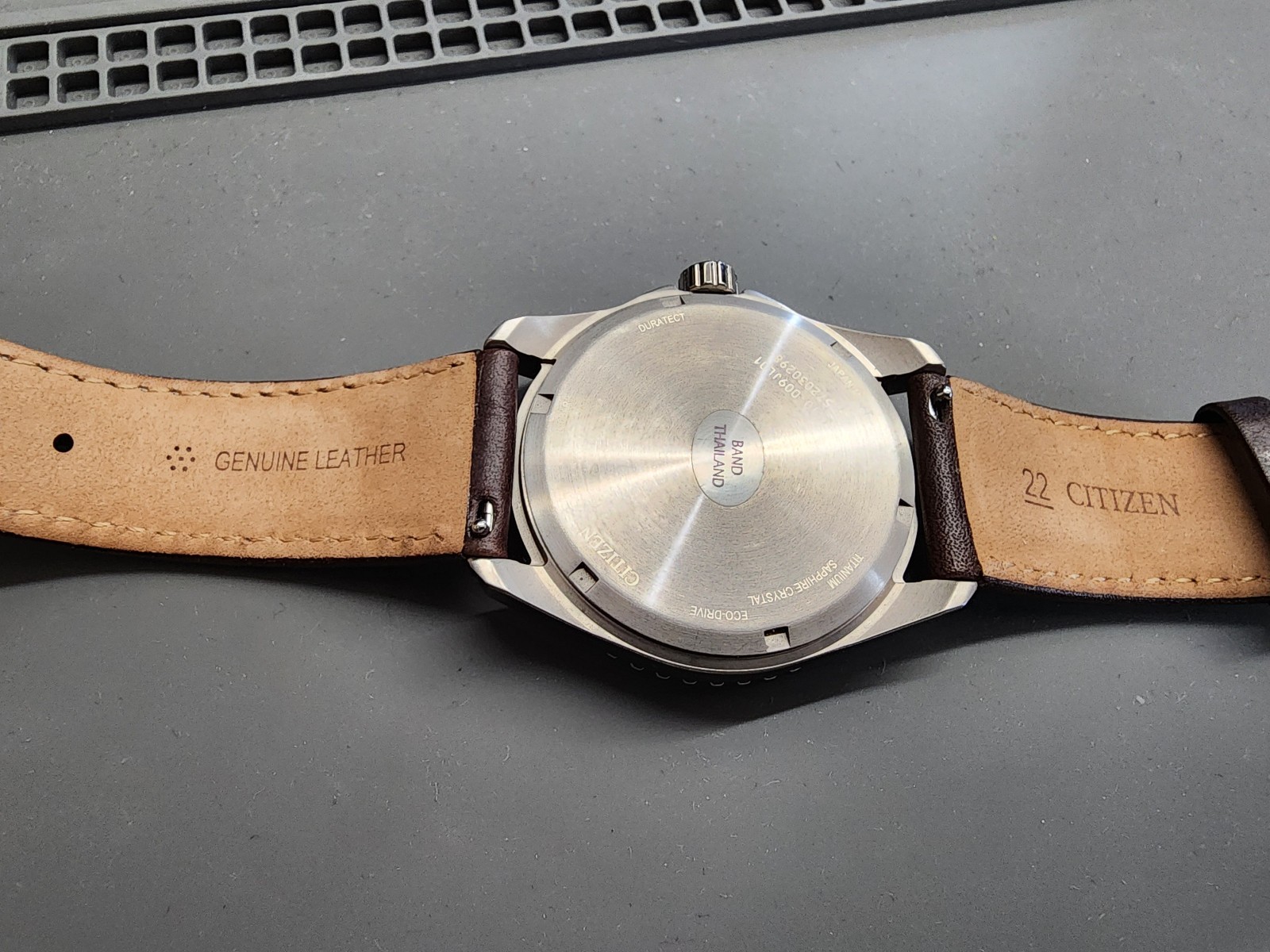 Citizen AW1840-09L Brycen Titanium Case Eco-Drive Leather Strap Blue Dial Watch