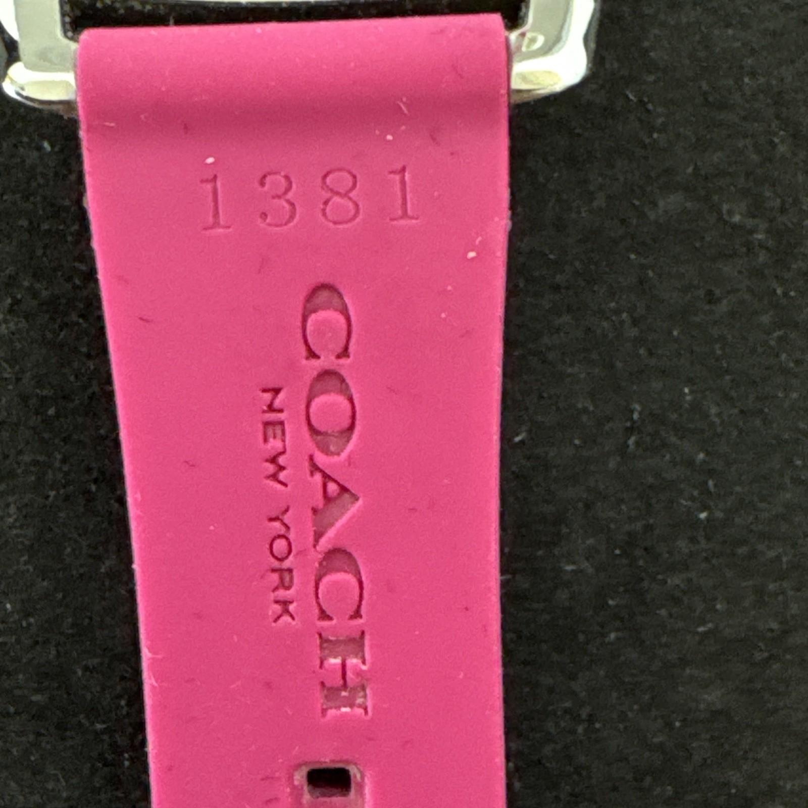 Coach Boyfriend watch featuring a vibrant pink logo-embossed silicone strap.