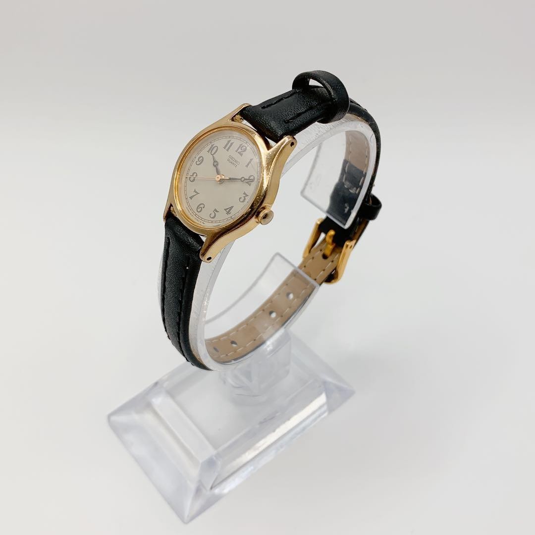 SEIKO 2C21-0170 Quartz Women’s Watch Ivory Dial Gold Case Black Strap