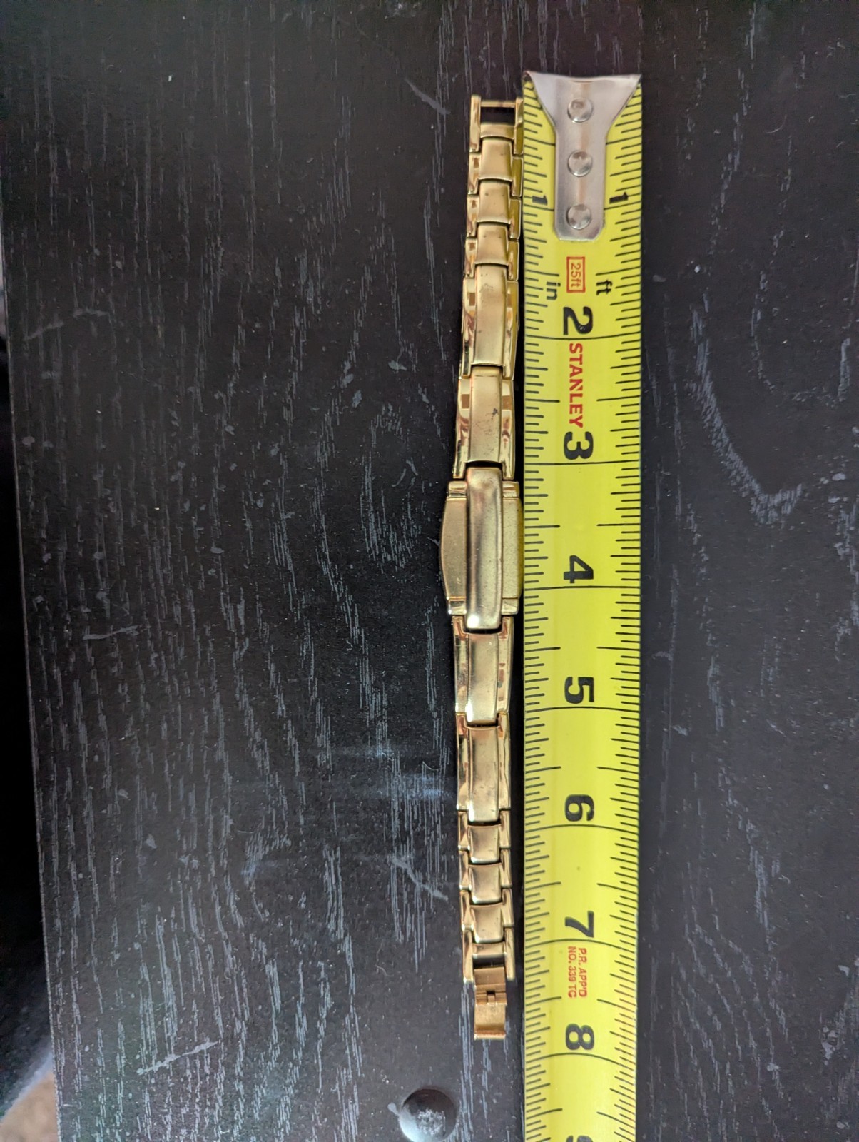 Gold plated watch by Royaltin with red crystal or Ruby not sure which. Very min