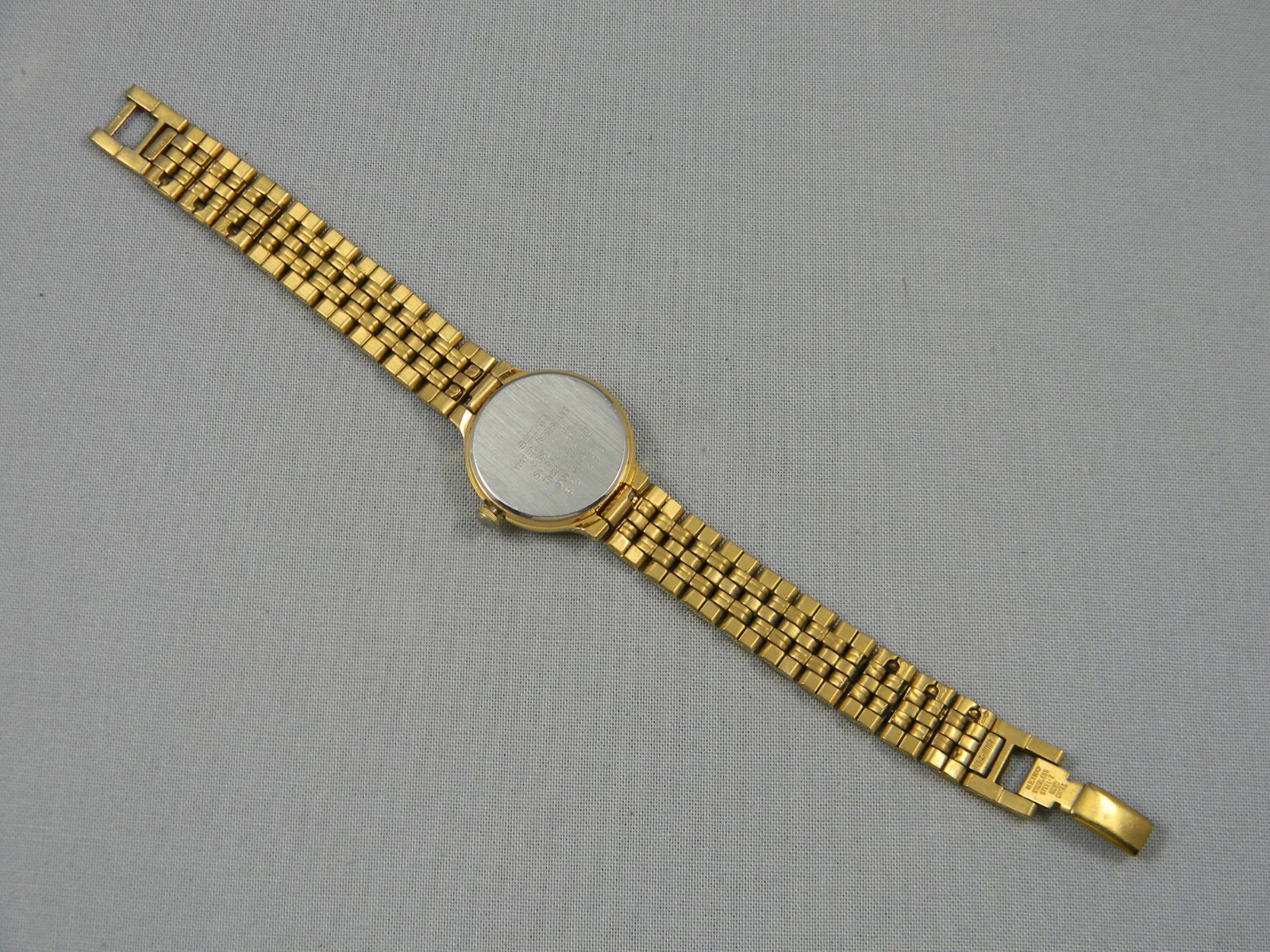 Vintage Seiko Watch Women 23mm Date Gold Tone Clasp Band 6.25″ New Battery