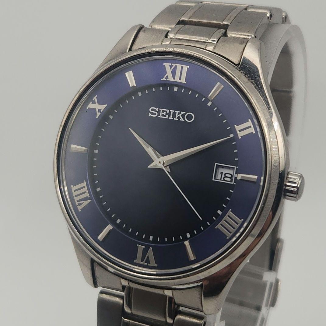Seiko Men’s Solar Watch Blue Dial Titanium Roman Date Japan Working 073641