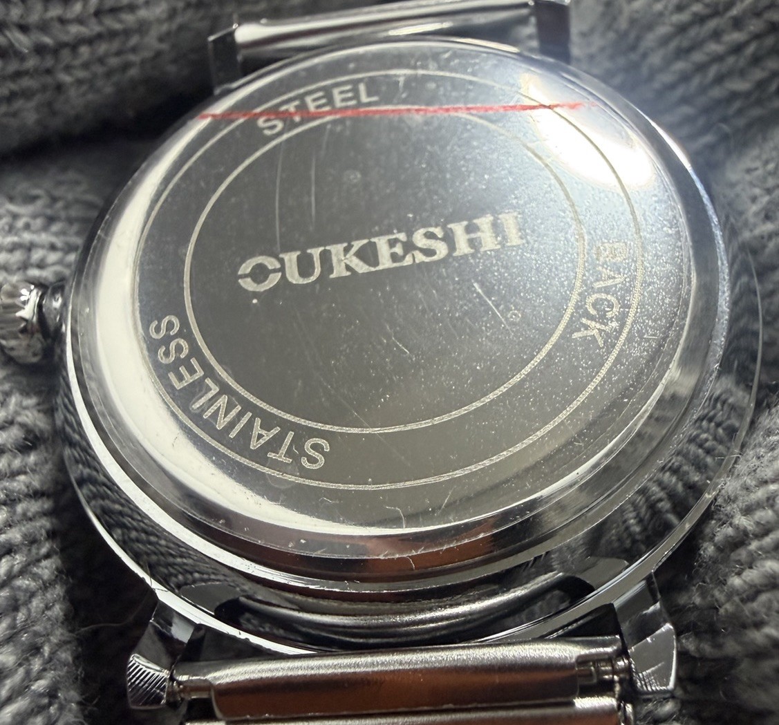 OUKESHI Orbit Dial Quartz Watch Mens Moon and Stars Pointer Steel Mesh Band