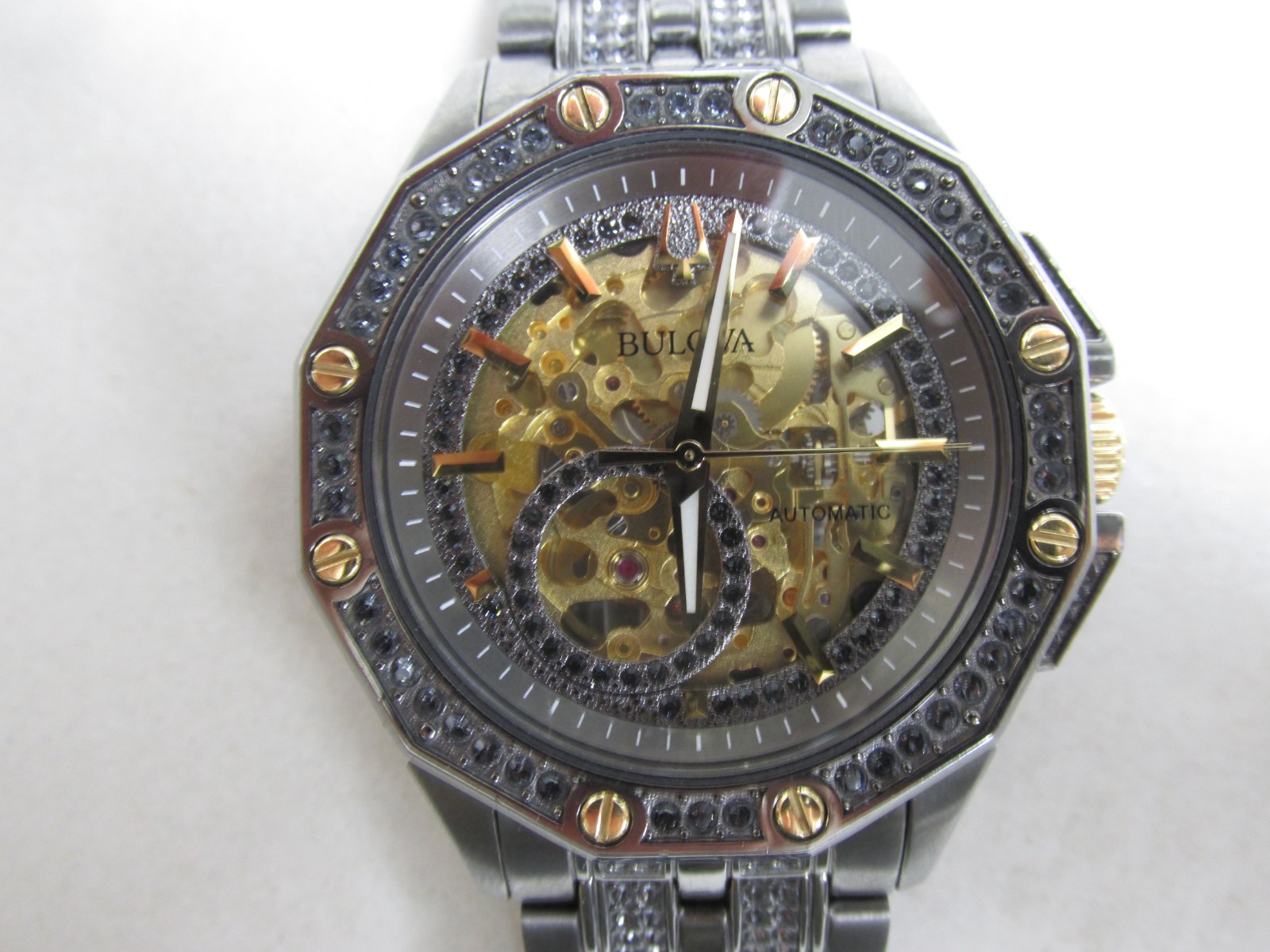 Bulova 98A293 Octava Automatic Gunmetal/Gold Skeleton Dial Men’s SS Watch