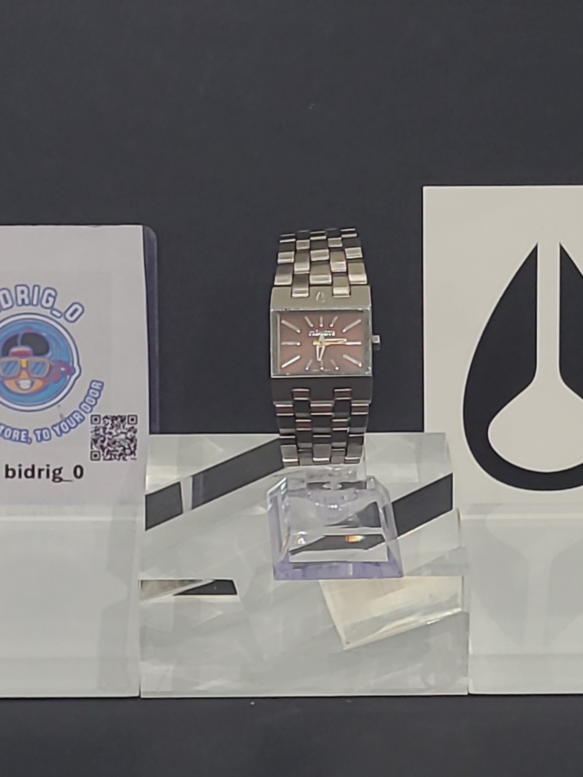 Nixon The Small Ticket “Thin To Win” Bronze/Silver Stainless Steel Swiss Mvmt.