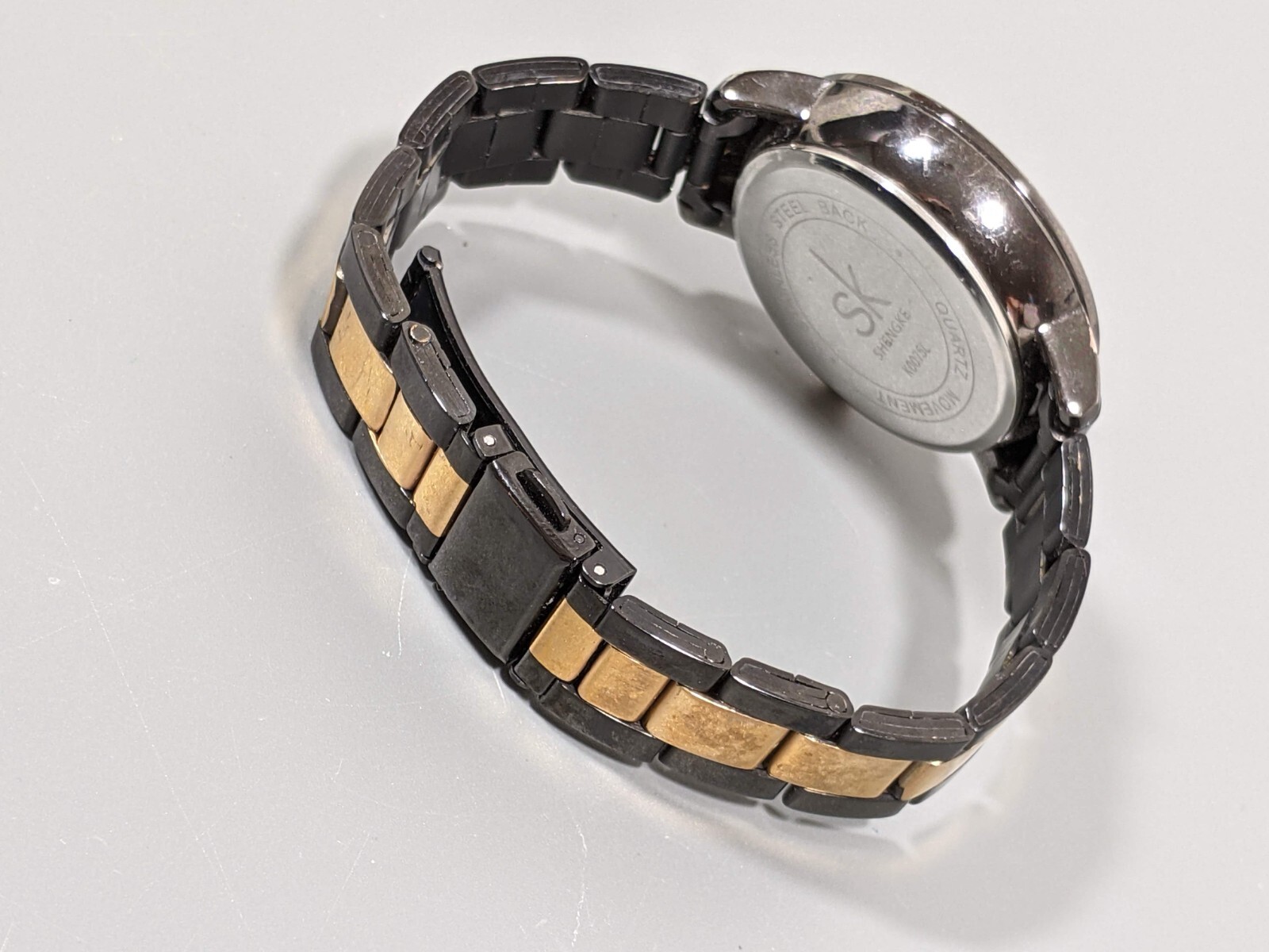 Shengke SK Womans Gunmetal Gray Gold Tone Crystal Accent Watch 6.75 in