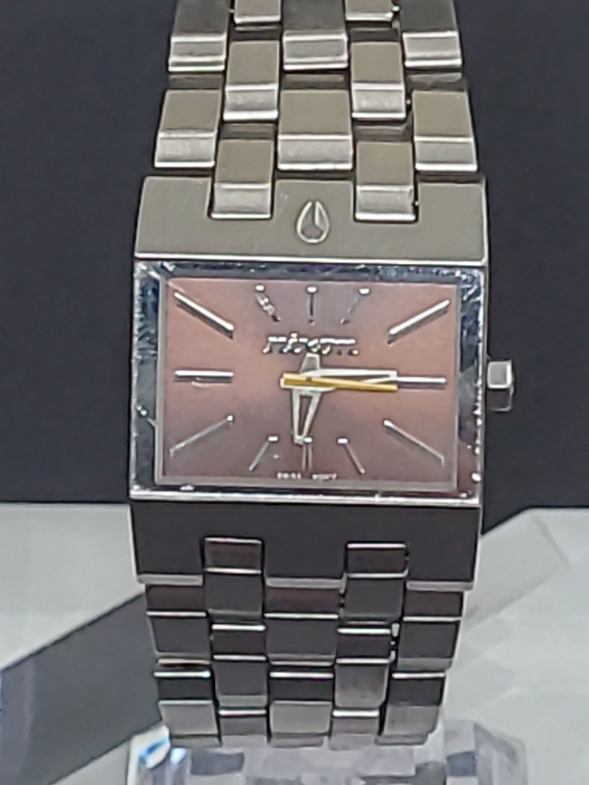 Nixon The Small Ticket “Thin To Win” Bronze/Silver Stainless Steel Swiss Mvmt.