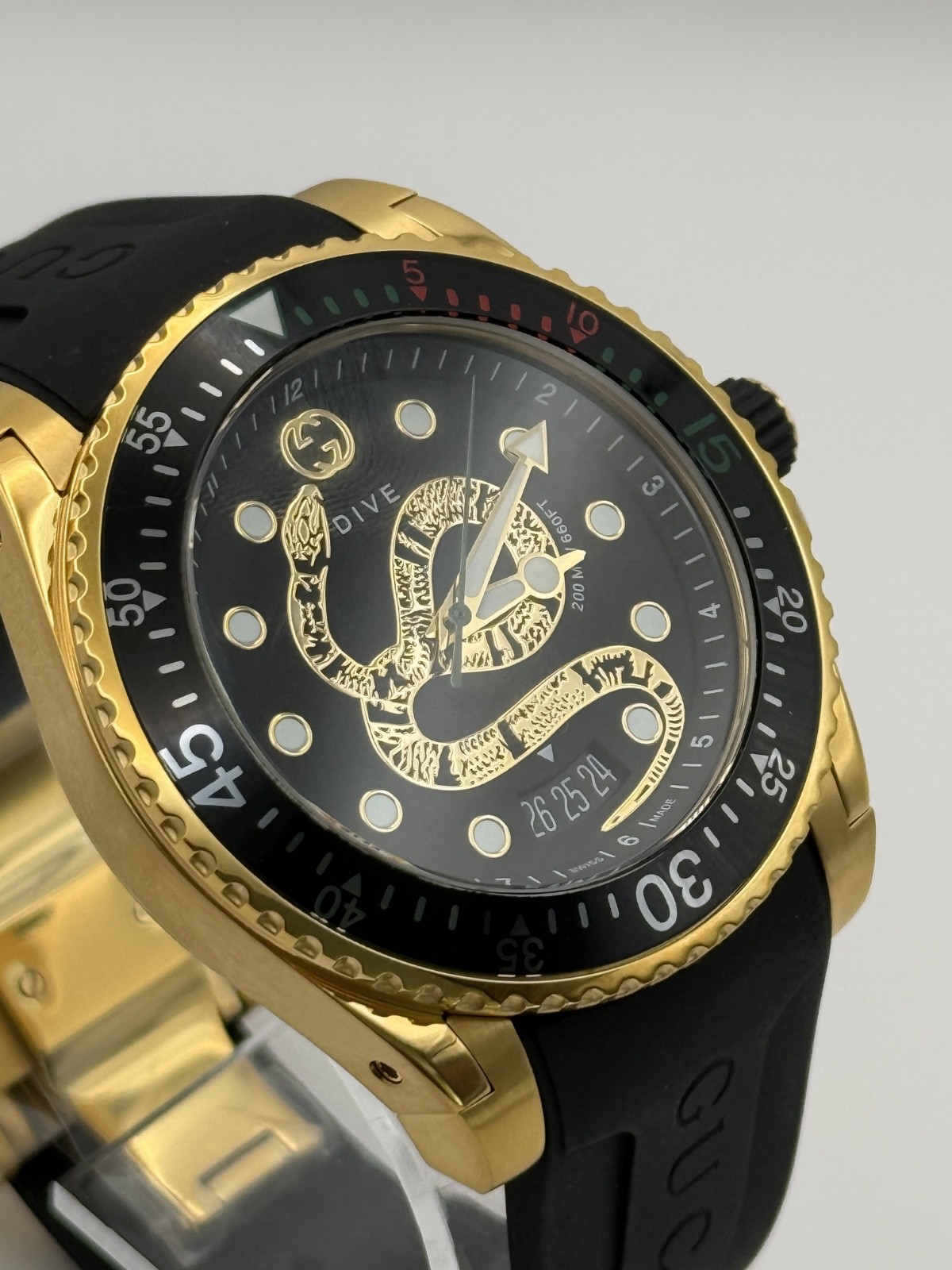 Gucci Dive Black Dial Gold-Tone Rubber Strap 45mm. Men’s Watch YA136219