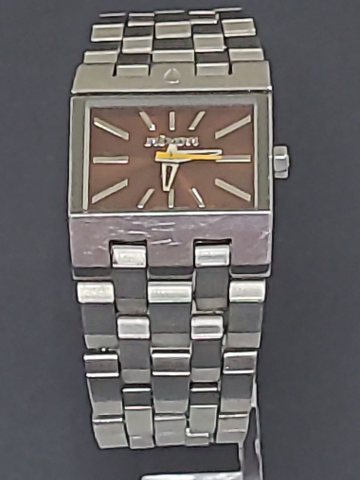 Nixon The Small Ticket “Thin To Win” Bronze/Silver Stainless Steel Swiss Mvmt.