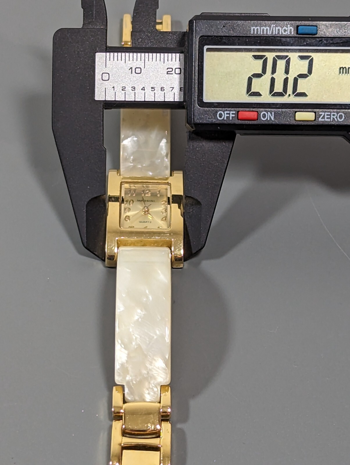Massini Gold Tone Dial Rectangle Case White Band Watch
