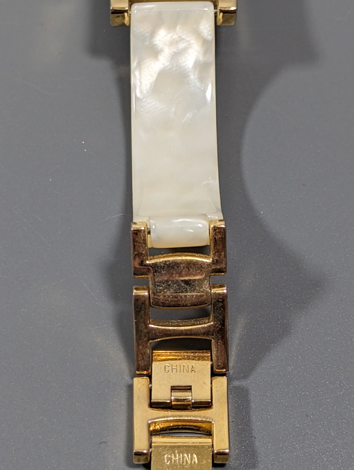 Massini Gold Tone Dial Rectangle Case White Band Watch