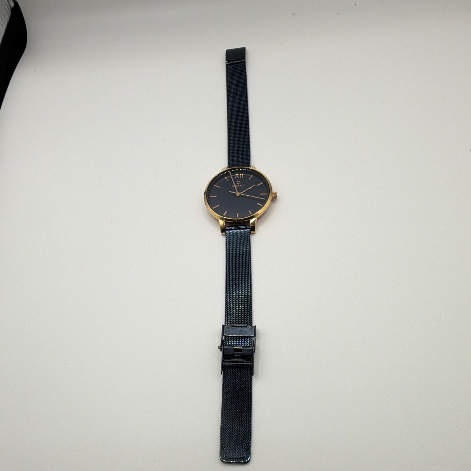 Obaku V209LXVLML Quartz Dress Watch Blue Dial Gold Case Black Mesh Bracelet