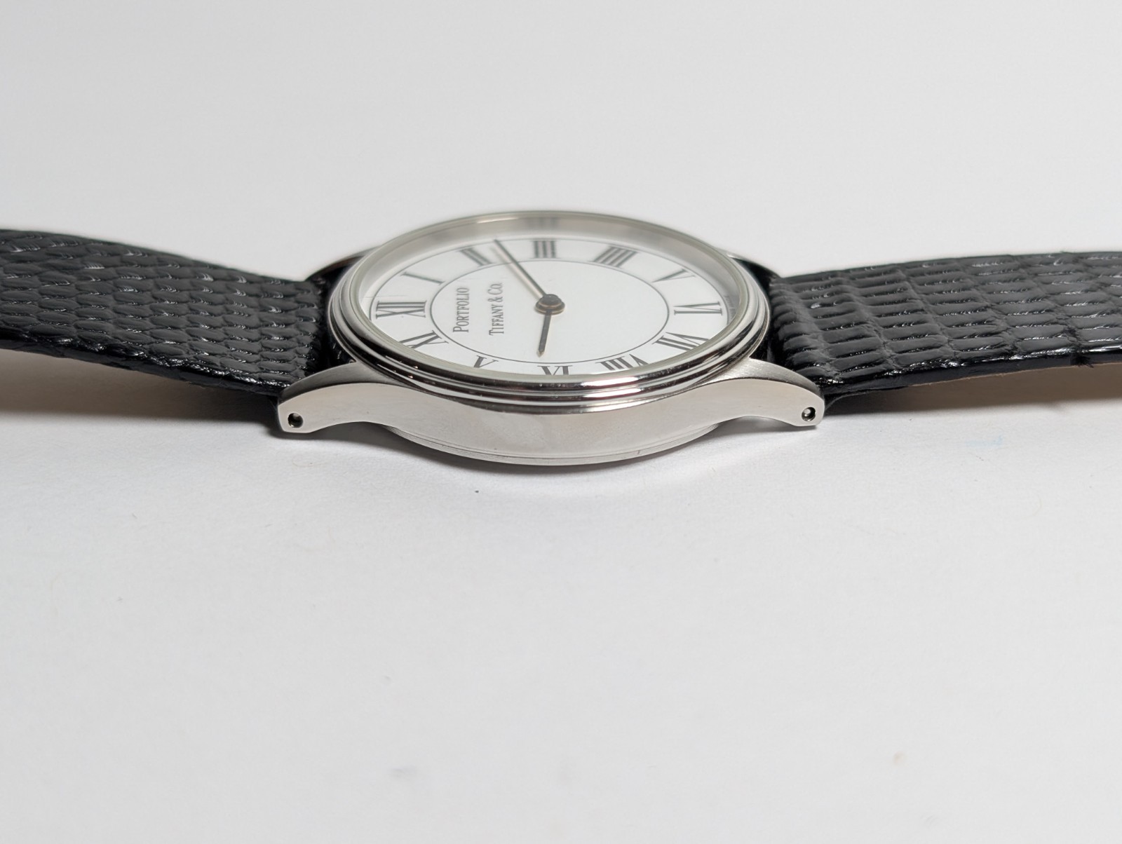 Vtg Tiffany & Co Portfolio Watch White Roman Dial Stainless Steel 33mm Swiss