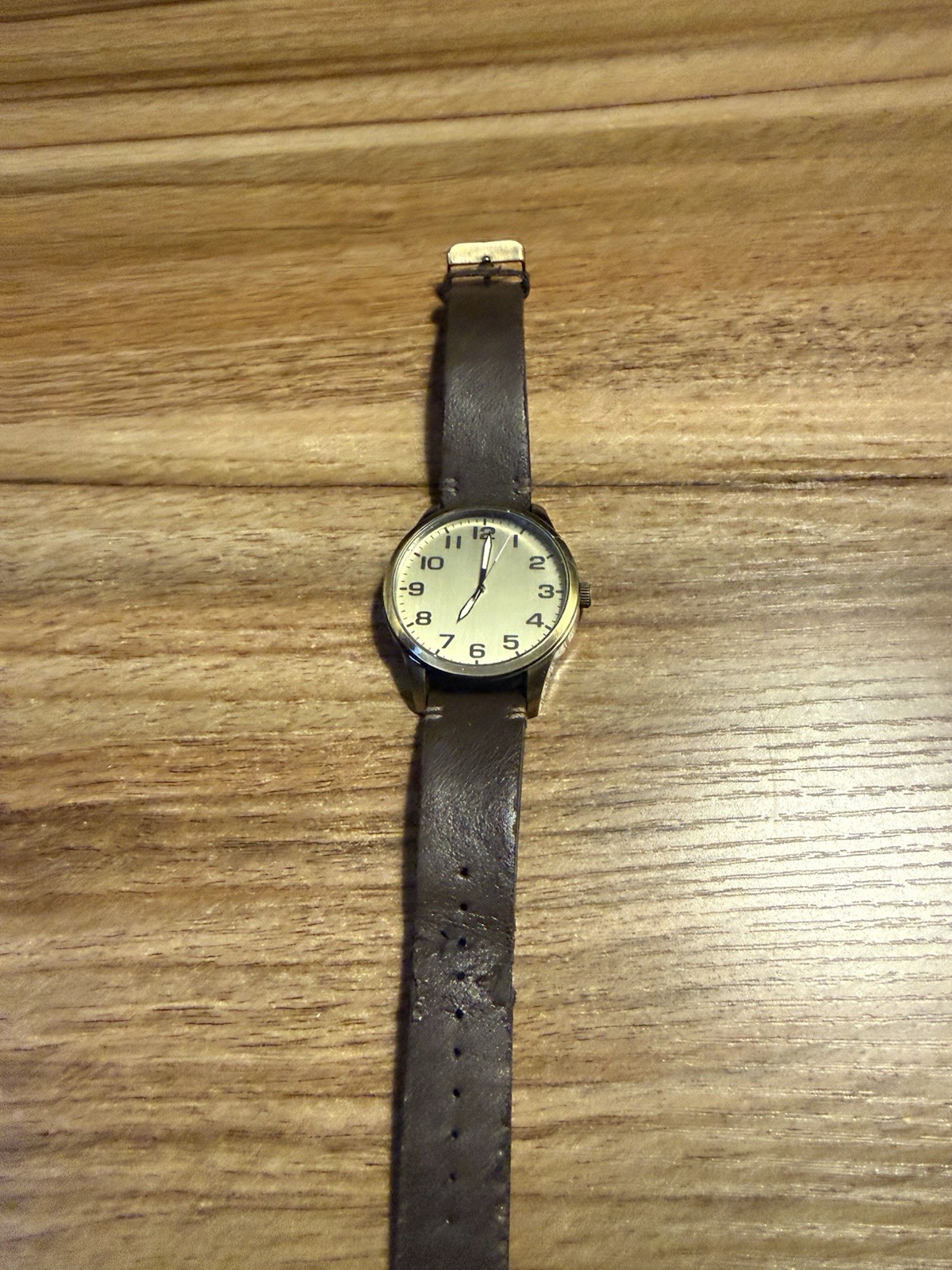 Analog Wristwatch White Dial Arabic Numerals Brown Leather Strap Black Case
