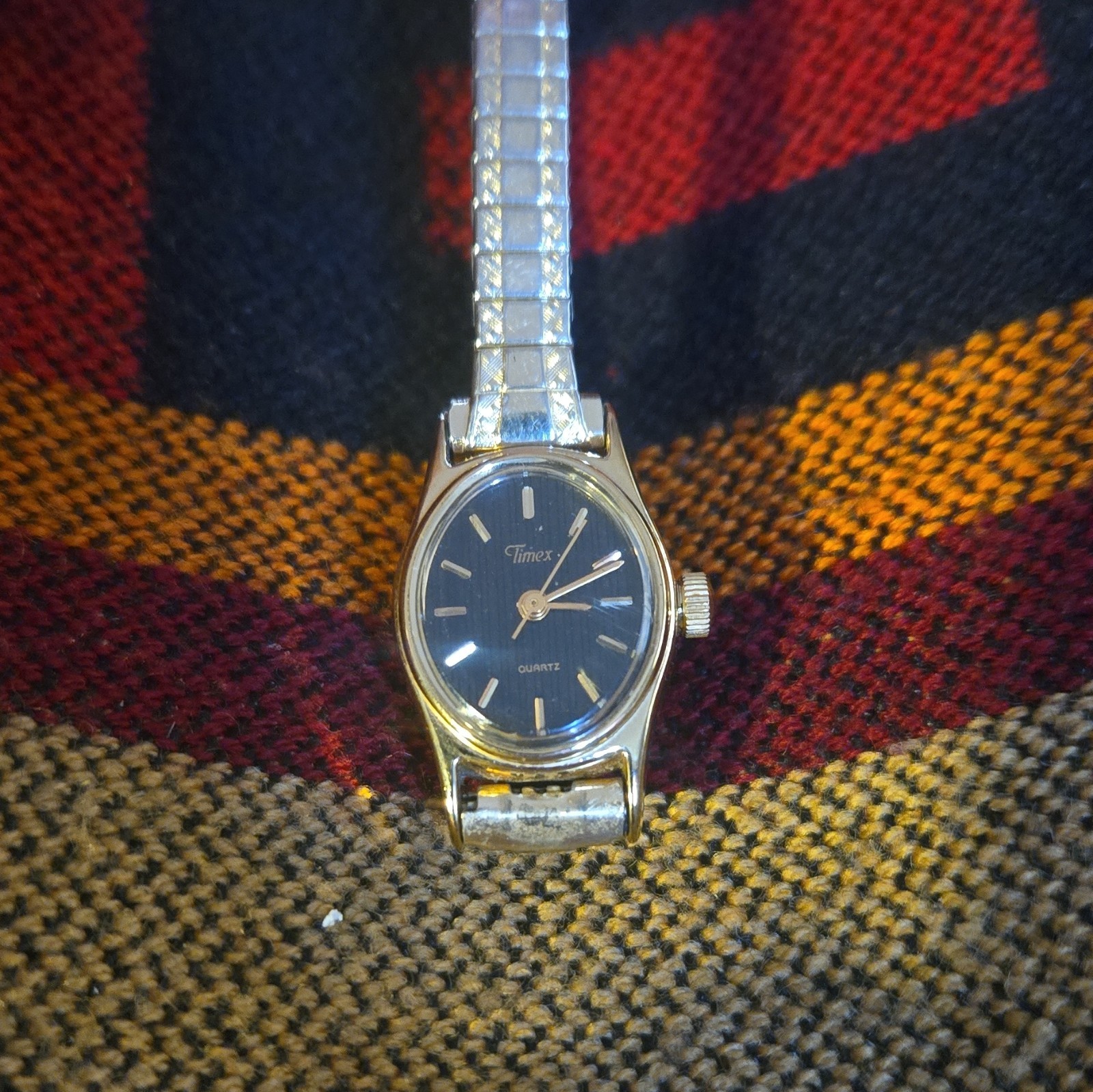 Timex Bacilli Quartz Women’s Oval Blue Dial Gold-Tone Case Silver Stretch Band