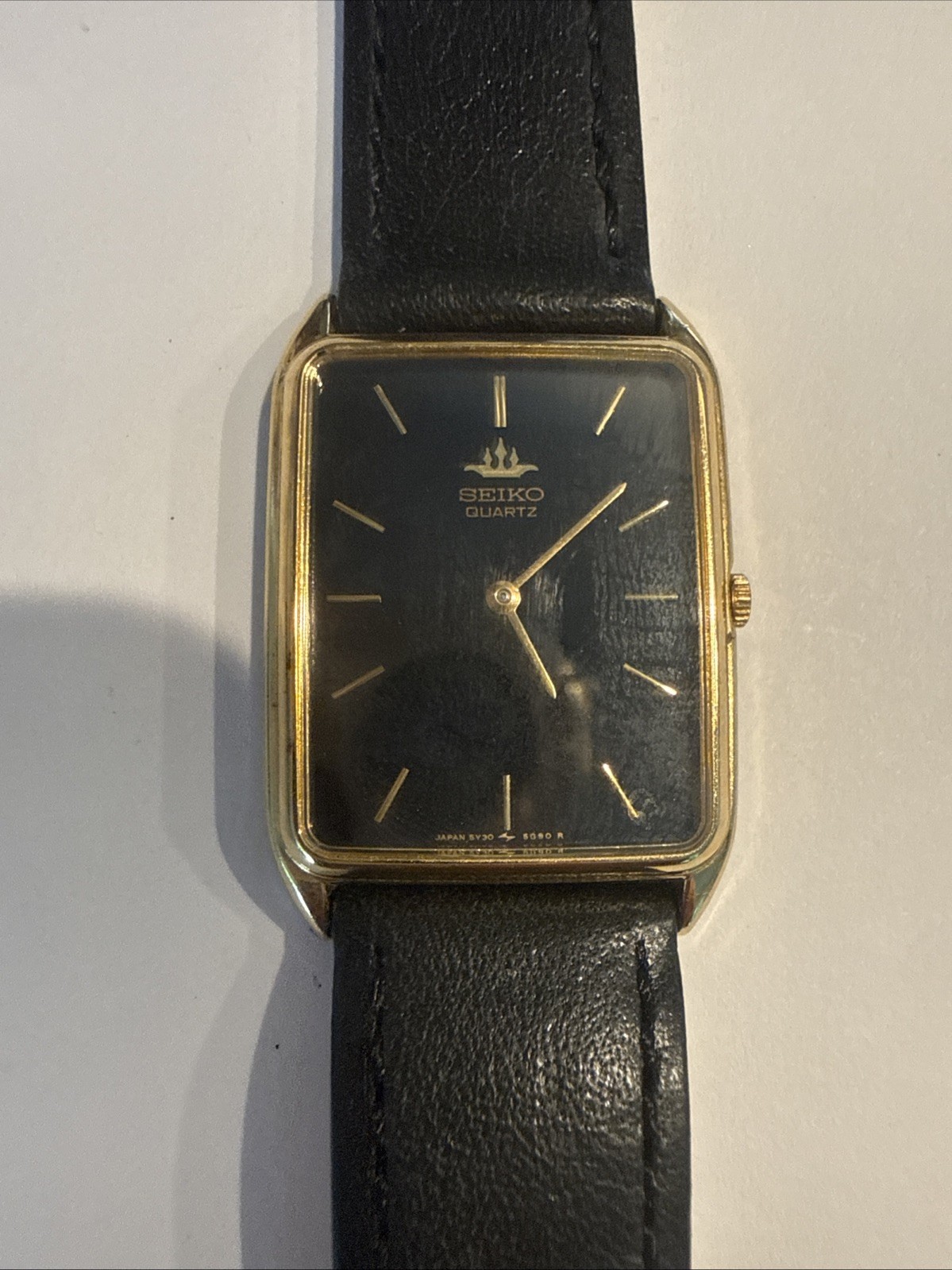 Seiko Men’s Gold Quartz Rectangular Wristwatch Black Dial Black Leather Band