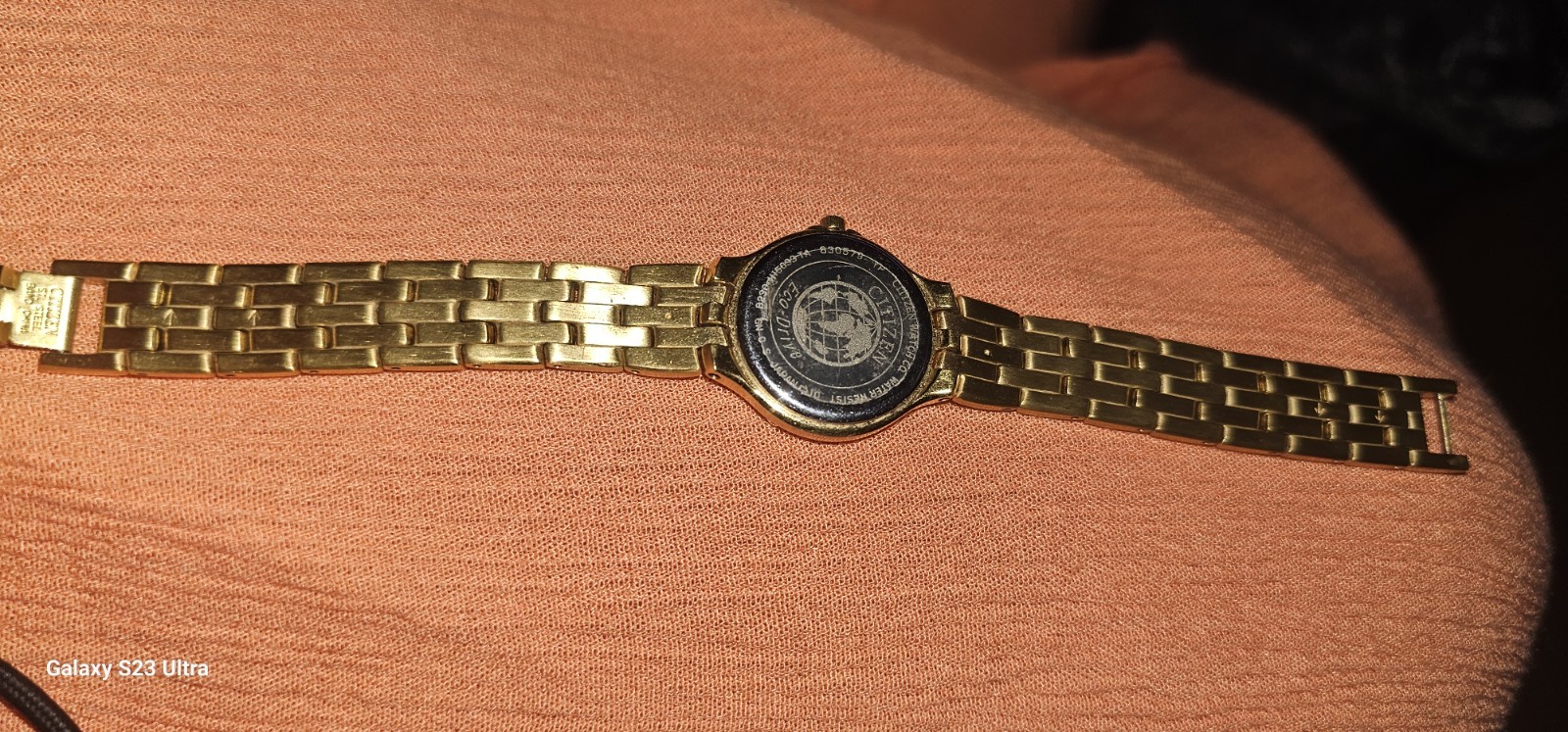 Citizen Solar-Tech women’s watch gold-tone link bracelet mother-of-pearl dial.