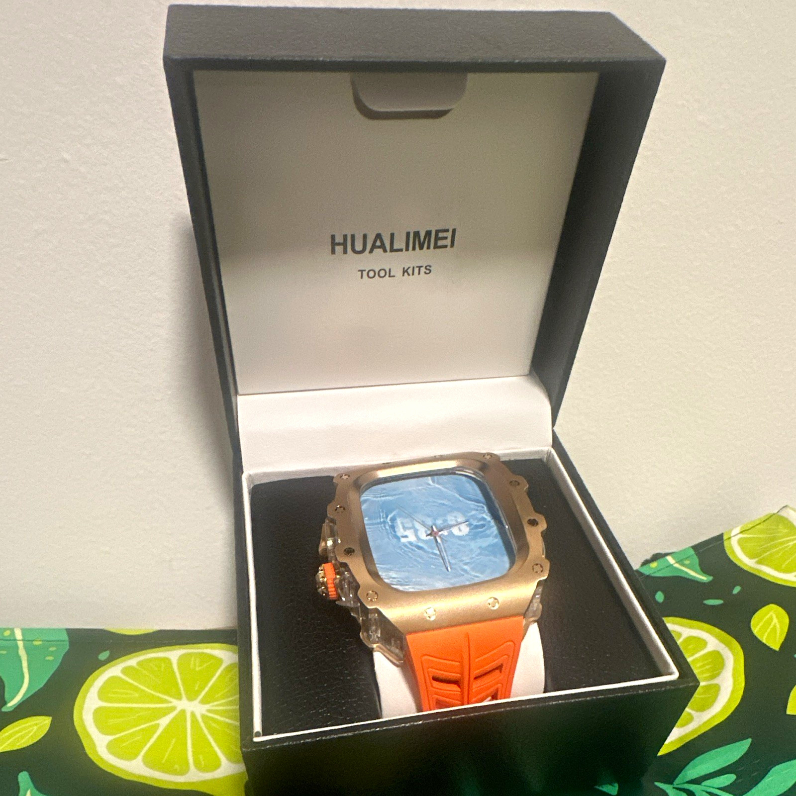 Hualimei Quartz Analog Sport Wristwatch Square Gold Case Orange Rubber Strap Box