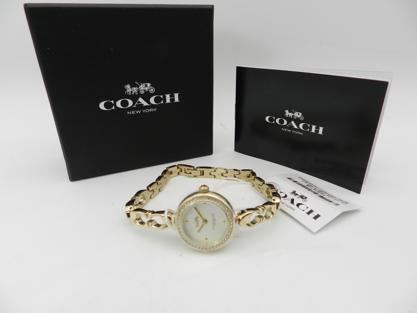 COACH Women’s Gracie Quartz Gold-Tone Stainless Steel Bangle Watch 23mm
